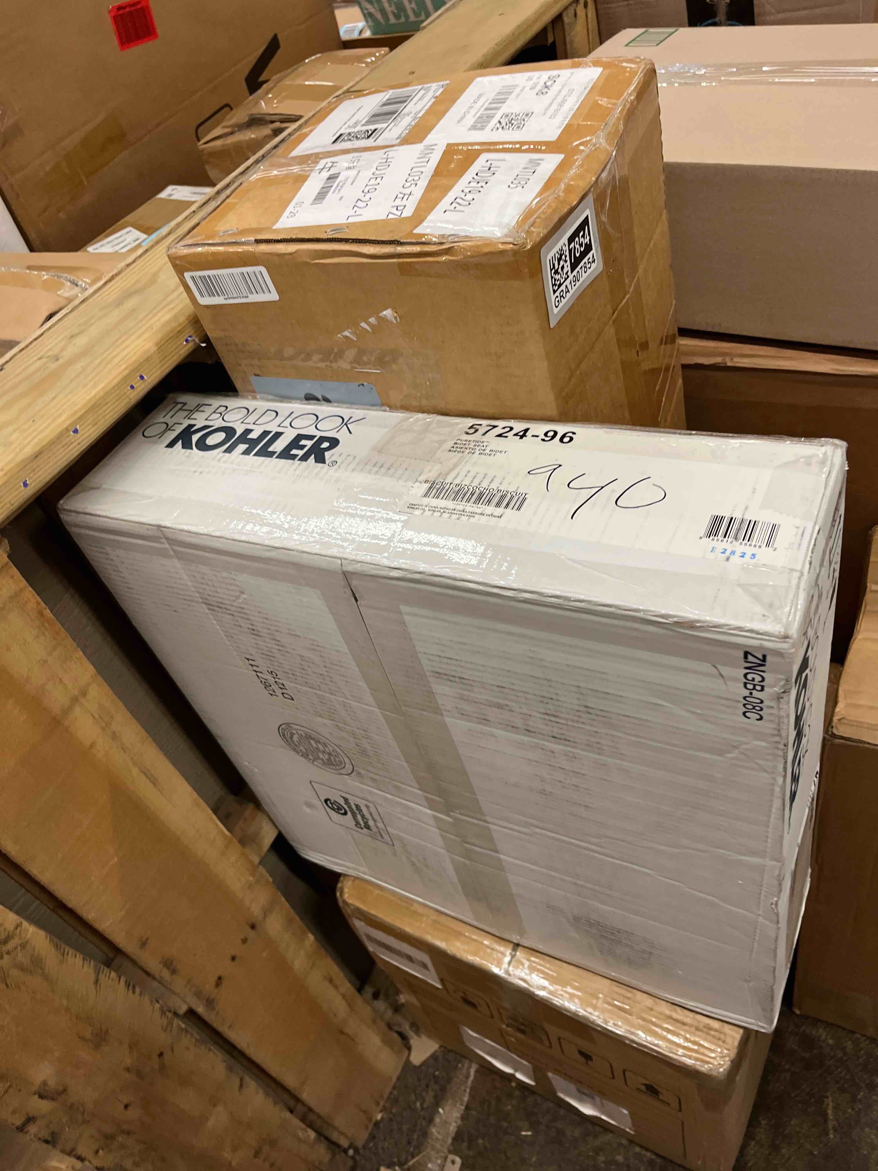 Condition photo showing New/Like New for kohler puretide quiet-close elongated manual bidet toilet seat - biscuit