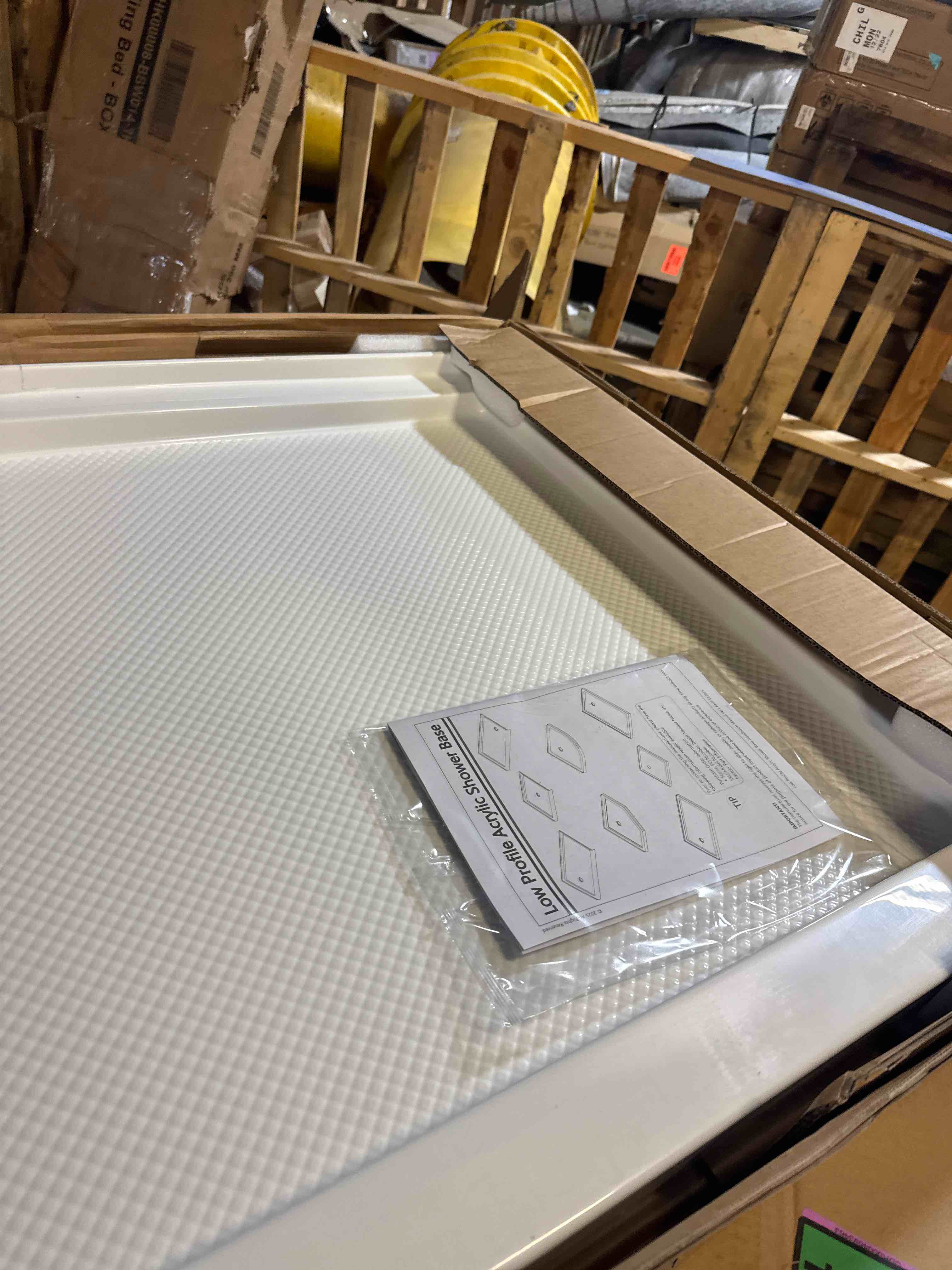 Condition photo showing New/Like New for slimline 34" x 60" shower base with single threshold and 3-1/4" left-hand drain ( has some cracks on back)