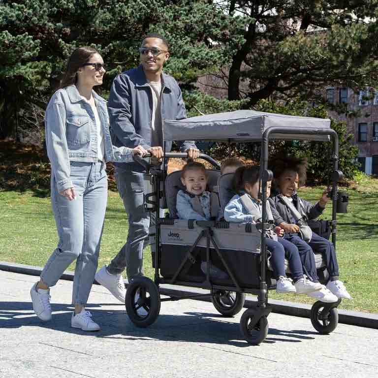 Jeep Wrangler Deluxe 4 Seater Stroller Wagon by Delta Children - Premium Quad Stroller Wagon for 4 Kids with Convertible Seats, Adjustable Push/Pull Handles, Removable Canopy & Flat Fold, Grey