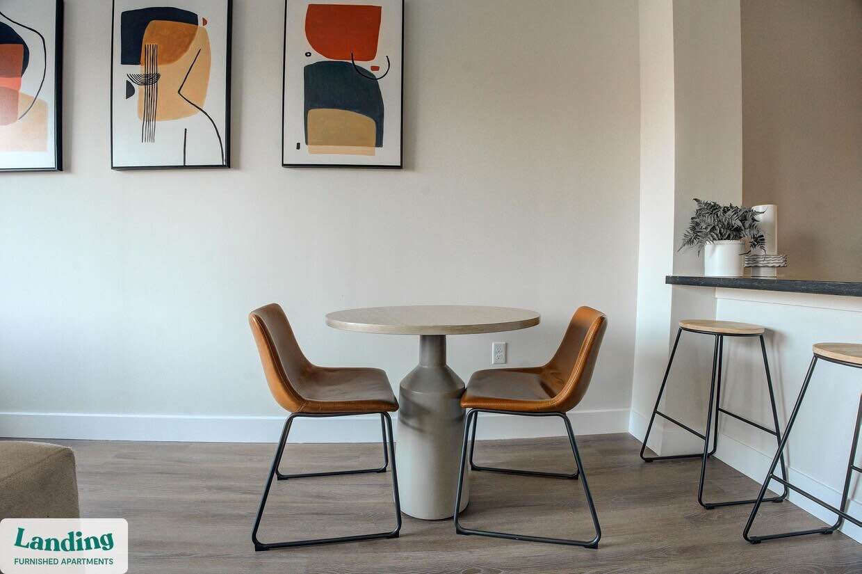 Grey Solid Concrete Mid Modern Outdoor/Indoor Dining Table, 59” W x 3” T x 32” H. Minor Chipping to table edge, Needs added support on base