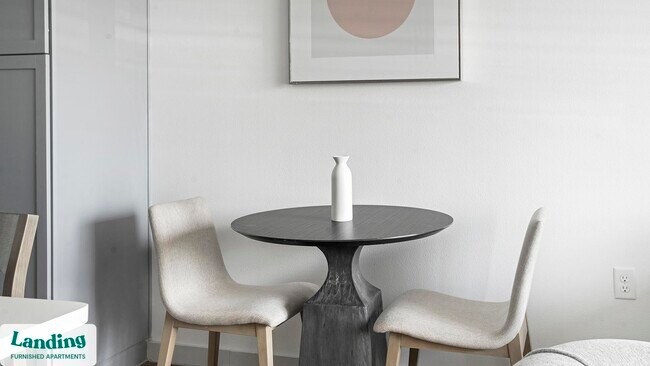 Mid Modern Grey Solid Wood Dining Table, Carved Base with Smooth Grey Round Table Top. Table Top is not attached for easy transport hardware is included. 40” W x 30.5” H 