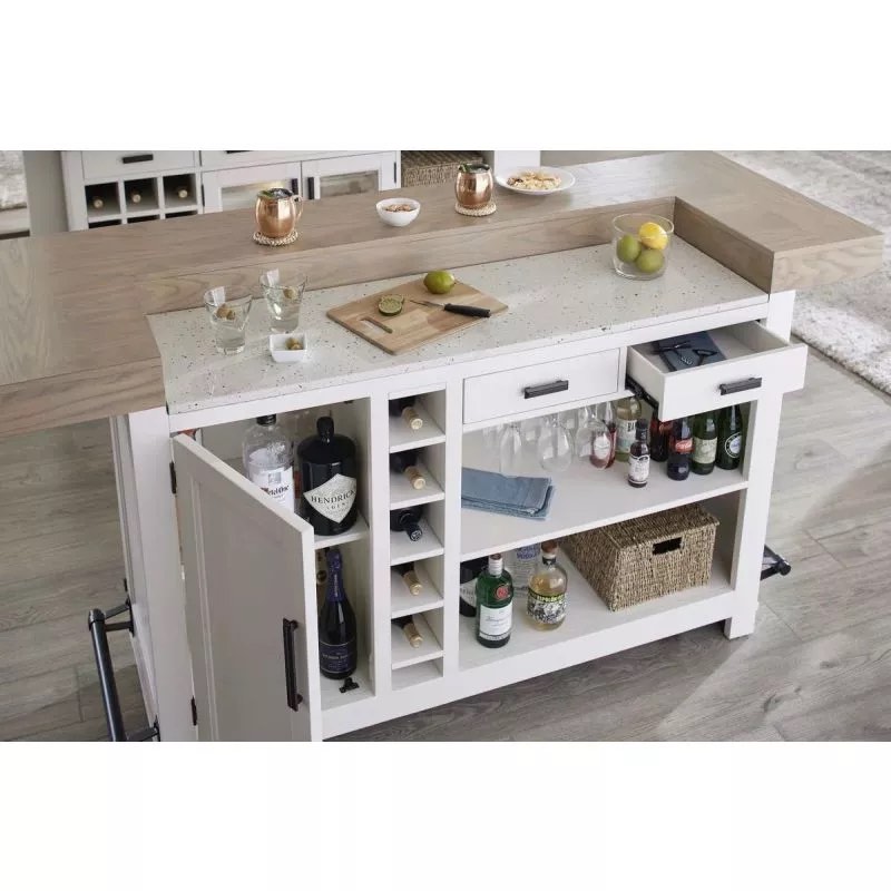 Parker House Americana Off White Oak Wood 78 in. Bar with White Quartz Insert, Burnished Bronze Handles. 1 Cabinet, 1 Open Shelf, 6 Tier Wine Shelf, 2 Drawers. Border sold separately. Quartz top in perfect condition. Buy and Repair- Can be a quality Island/Bar piece for your kitchen if small cracks on edges paint over, hairline crack on rim, handle needs replaced, some chipping on front end.