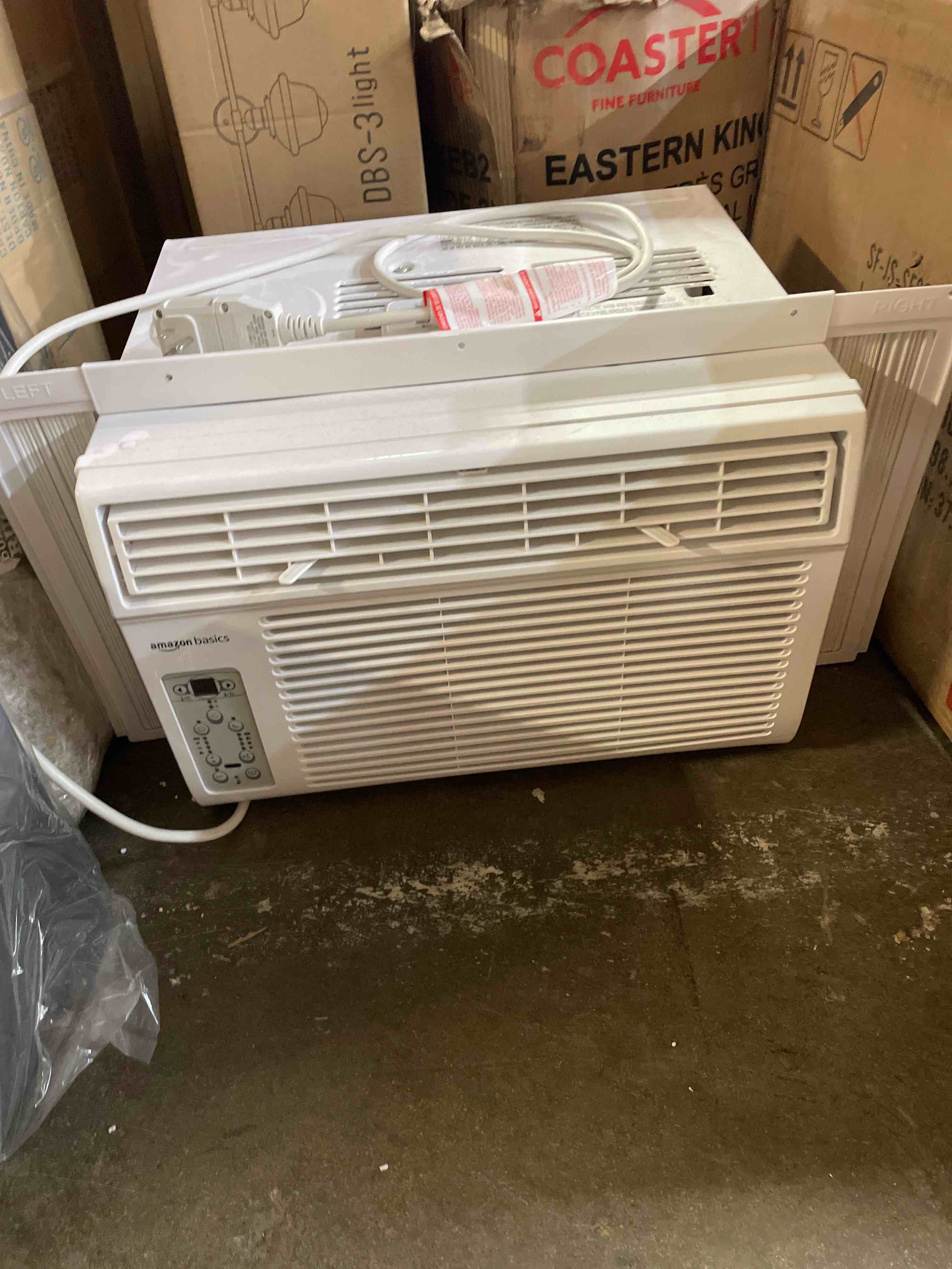 Condition photo showing As Is for amazon basics 6000-btu window air conditioner with quiet operation, up to 250 sqf, cool and fan functions, washable filter, adjustable window kit, digital temperature display, remote control, white