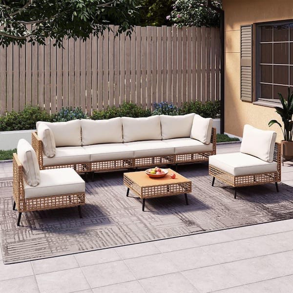 brown 7-piece wicker patio conversation set with beige cushions and coffee table(box 2 only)