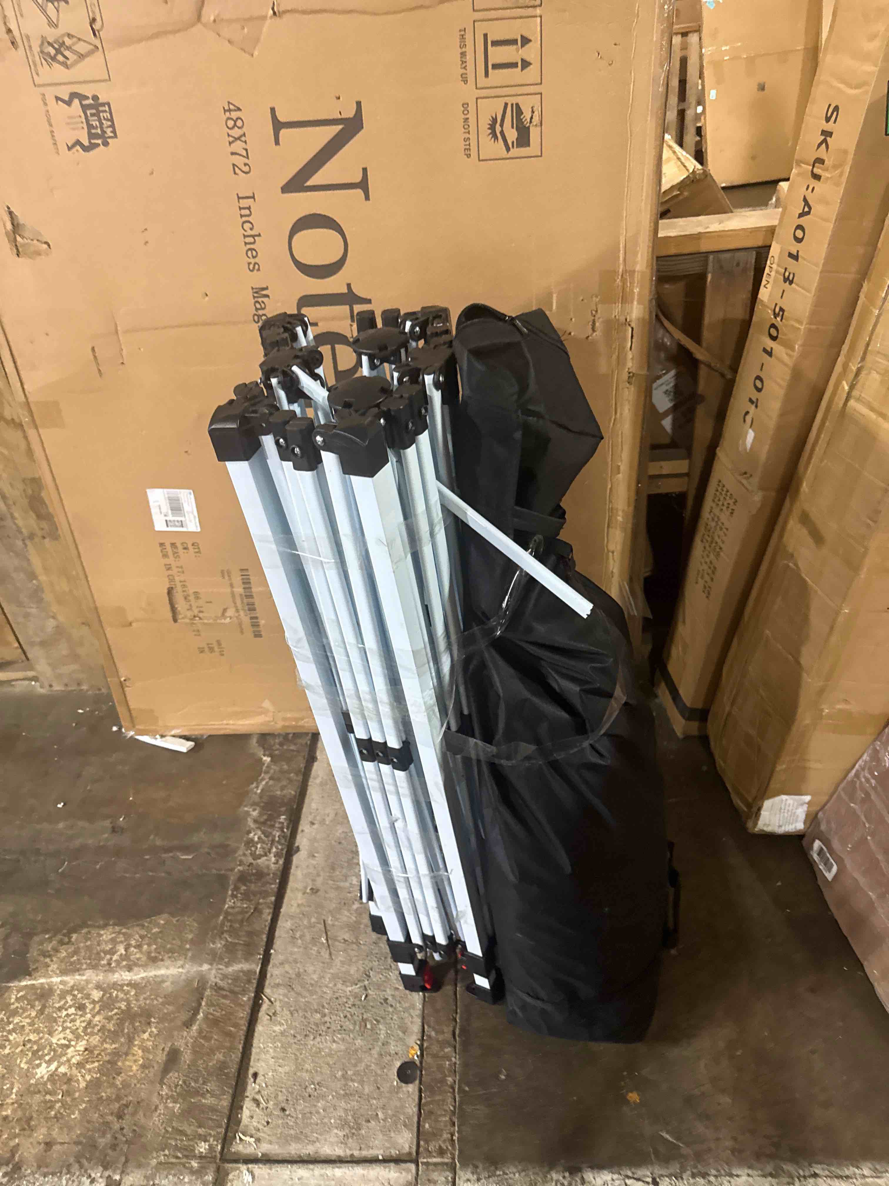 Condition photo showing As Is for crown shades 10x10 pop up canopy tent - patented center lock one push instant outdoor canopy beach tent with sto-n-go bag 8 stakes & 4 sand bags?grid grey (damaged)