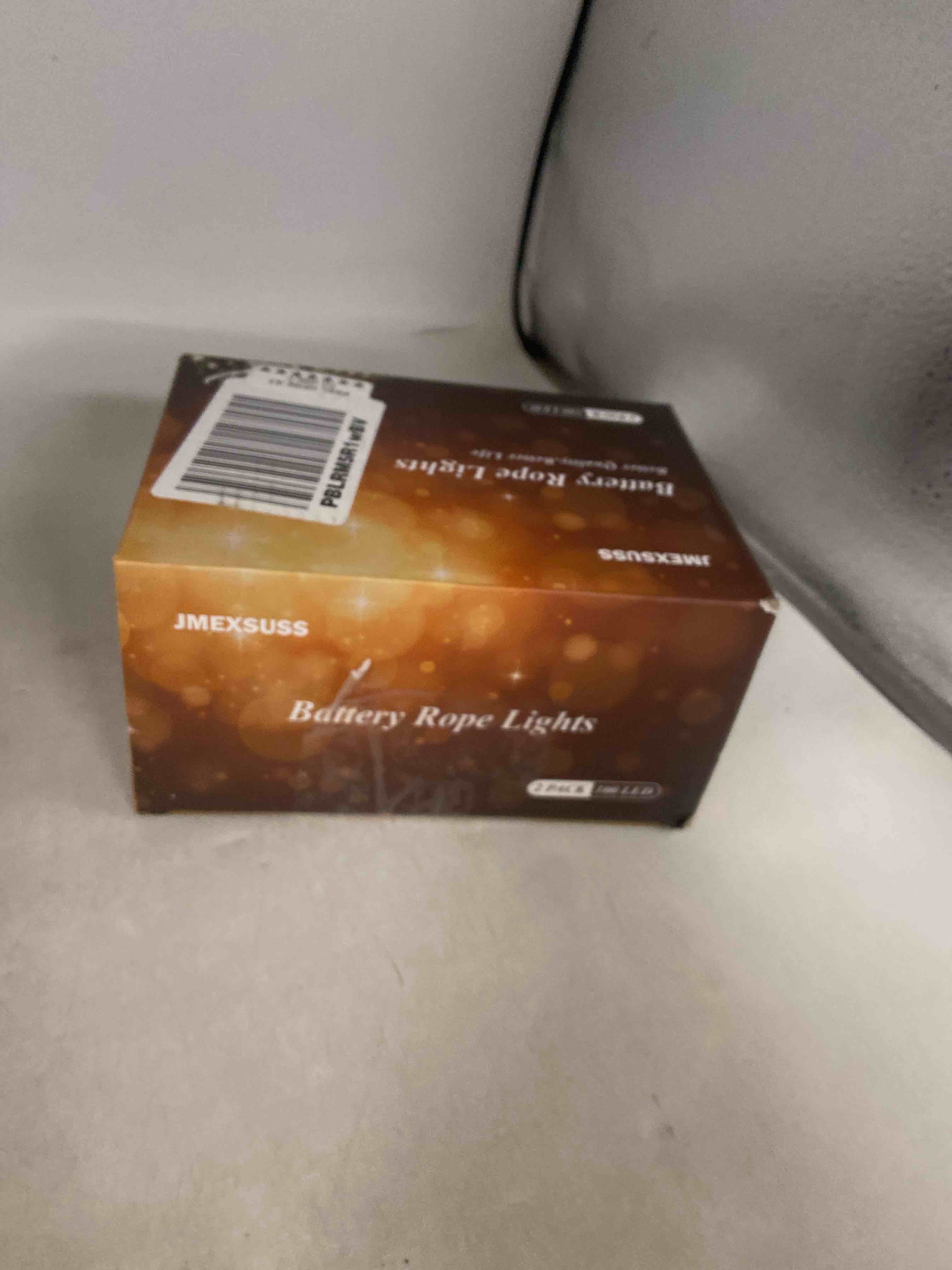 Condition photo showing New/Like New for JMEXSUSS 2 Pack Christmas Lights Battery Operated Rope Lights Outdoor Waterproof Total 200LED 8 Modes Battery Powered String Lights with Remote for Car Trampoline Tree Christmas Decor (Multicolor) 2*100LED Multicolor