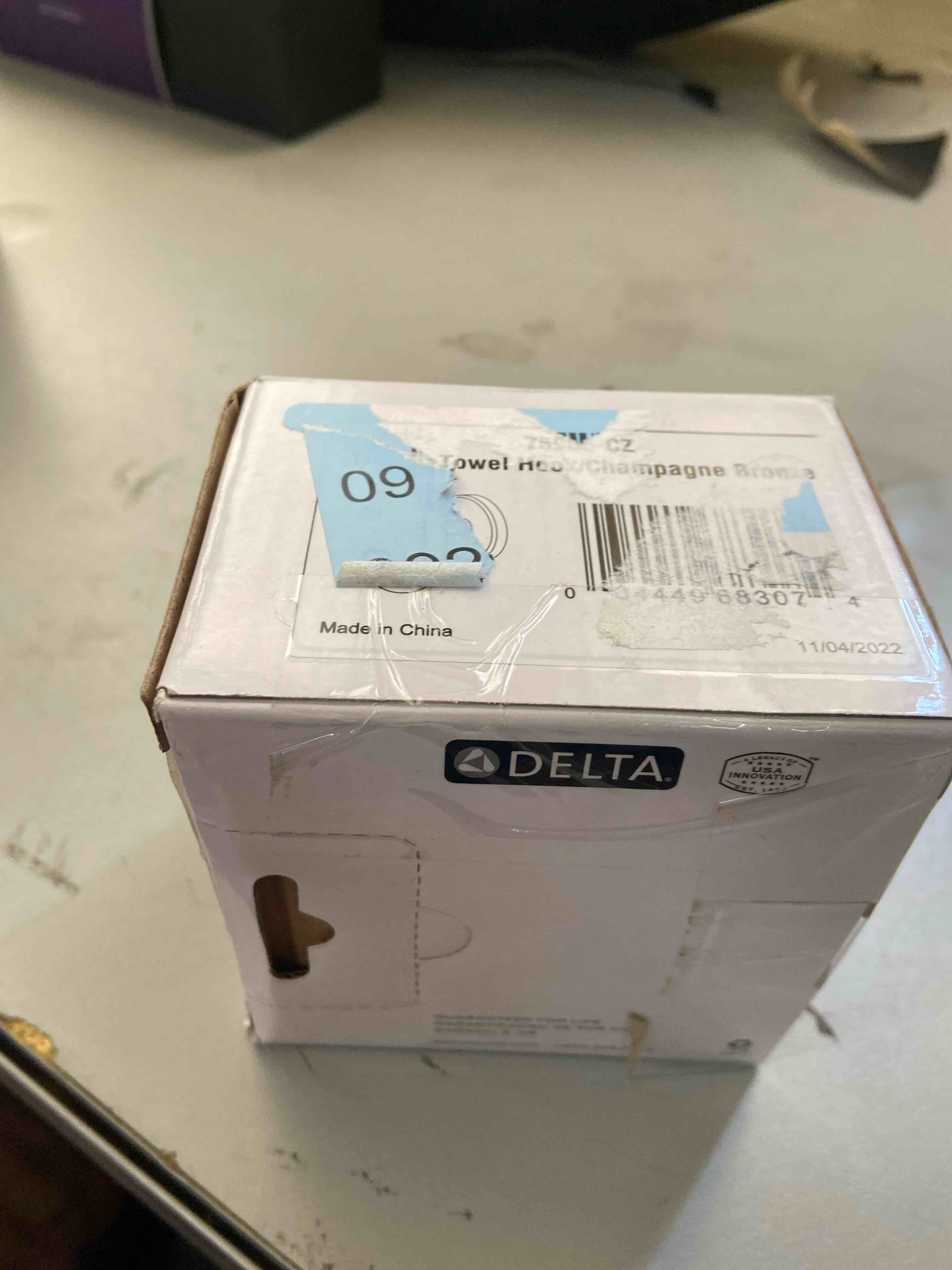 Condition photo showing New/Like New for Delta Trinsic Robe Hook  Champagne Bronze