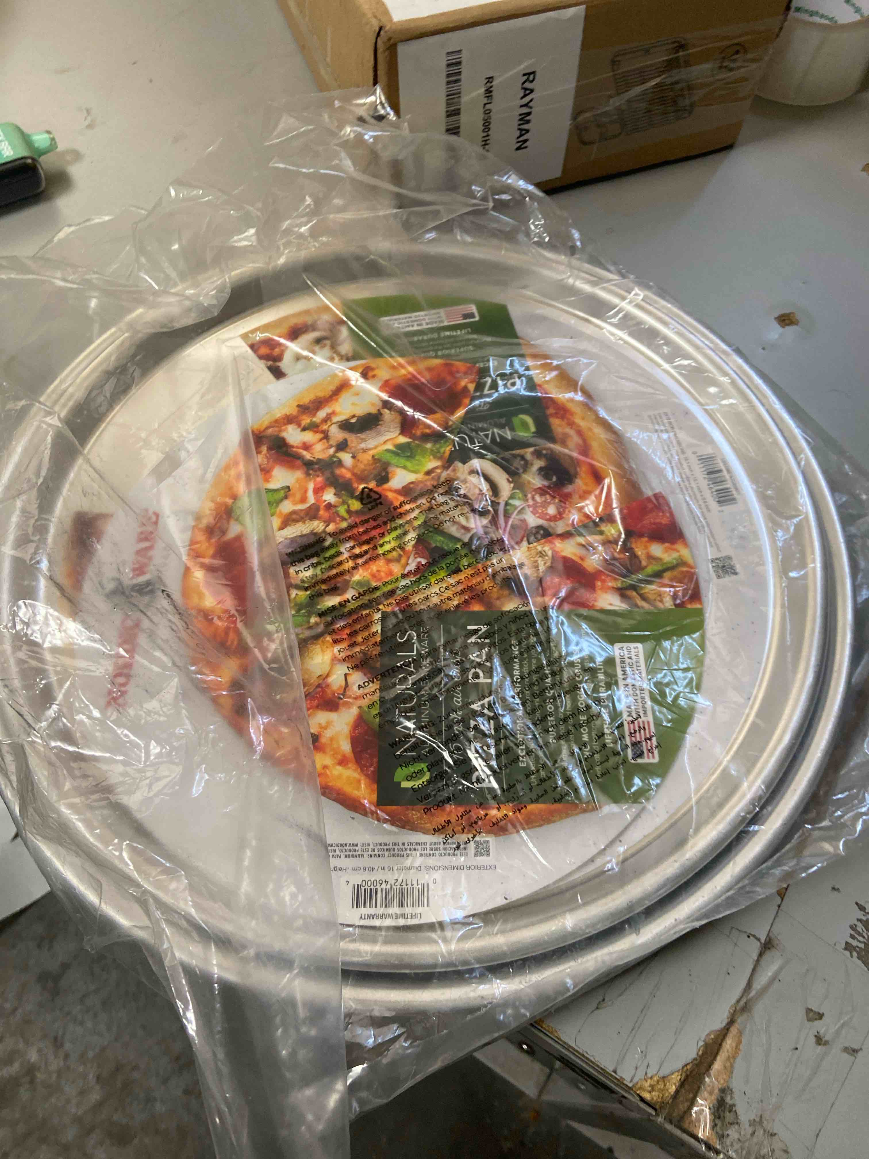 Condition photo showing New/Like New for Nordic Ware Naturals® Traditional Pizza Pan