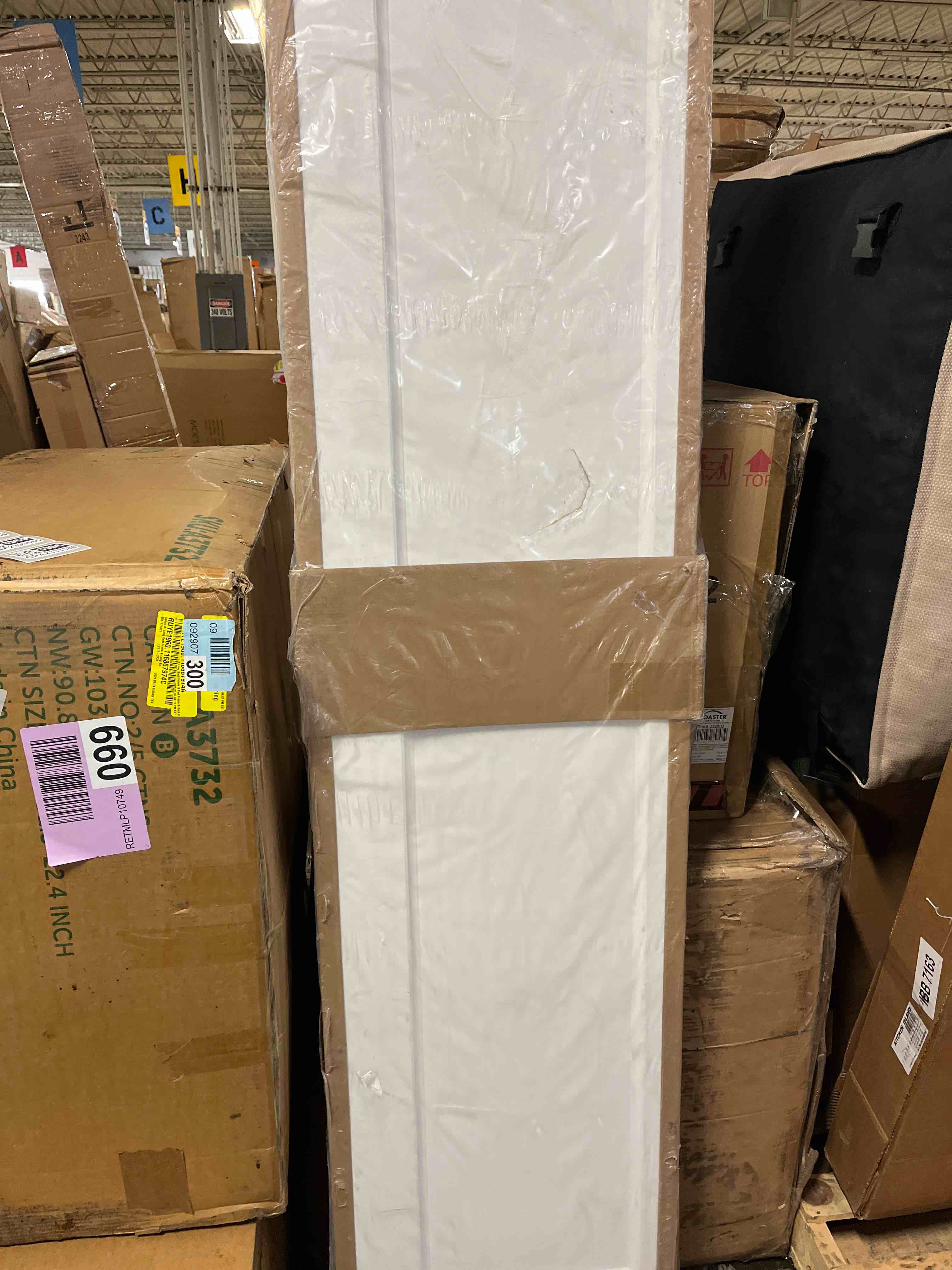 Condition photo showing As Is for BarnSmith 30 in.x 80 in. Bifold Barn Door, 1 Panel White Primed Bifold Closet Door, Hollow Core Interior Barn Doors with Hardware Kit White 30''x80''(DOOR IS DAMAGED)