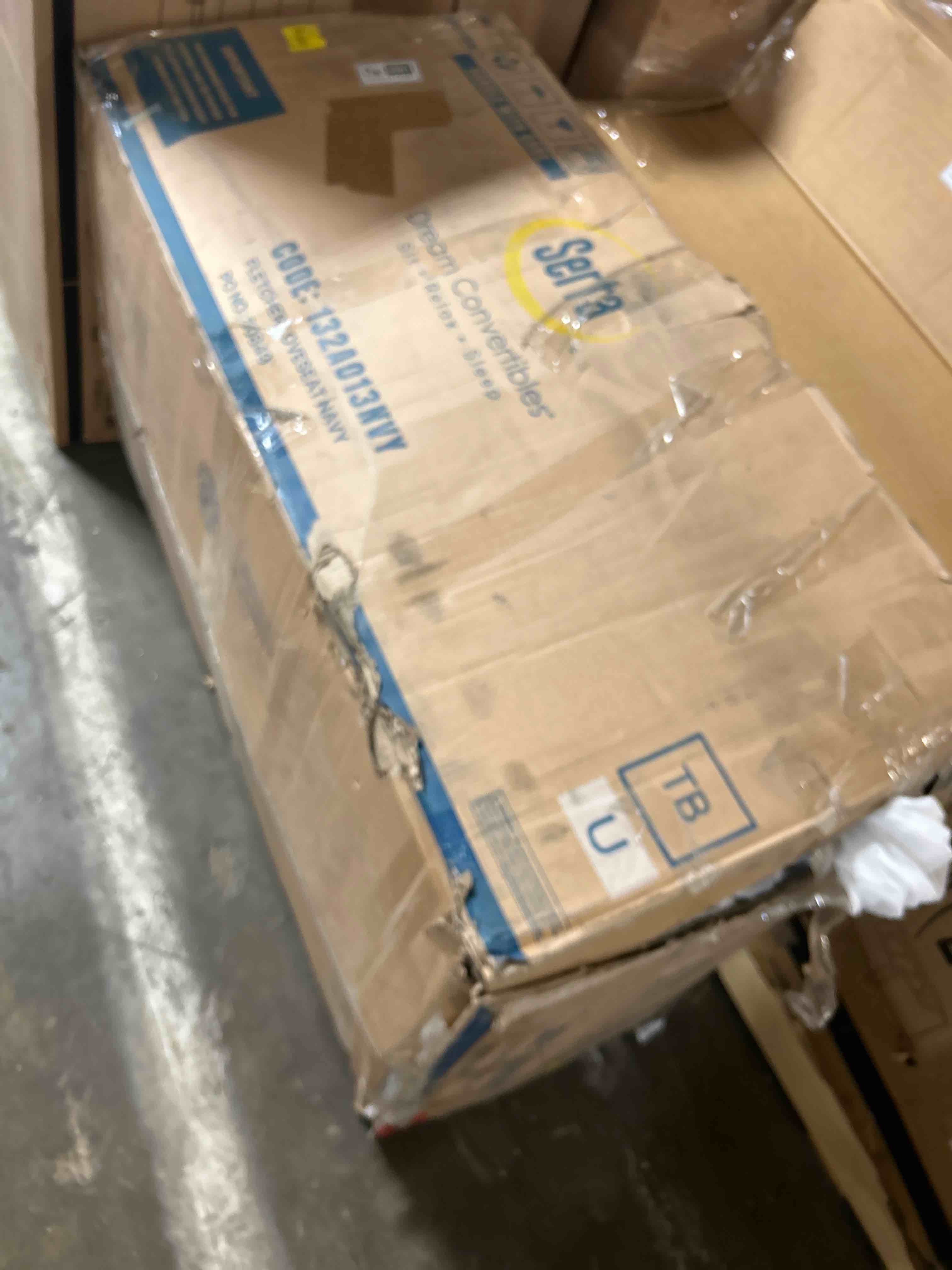 Condition photo showing As Is for Fletcher loveseat navy (Box damaged )