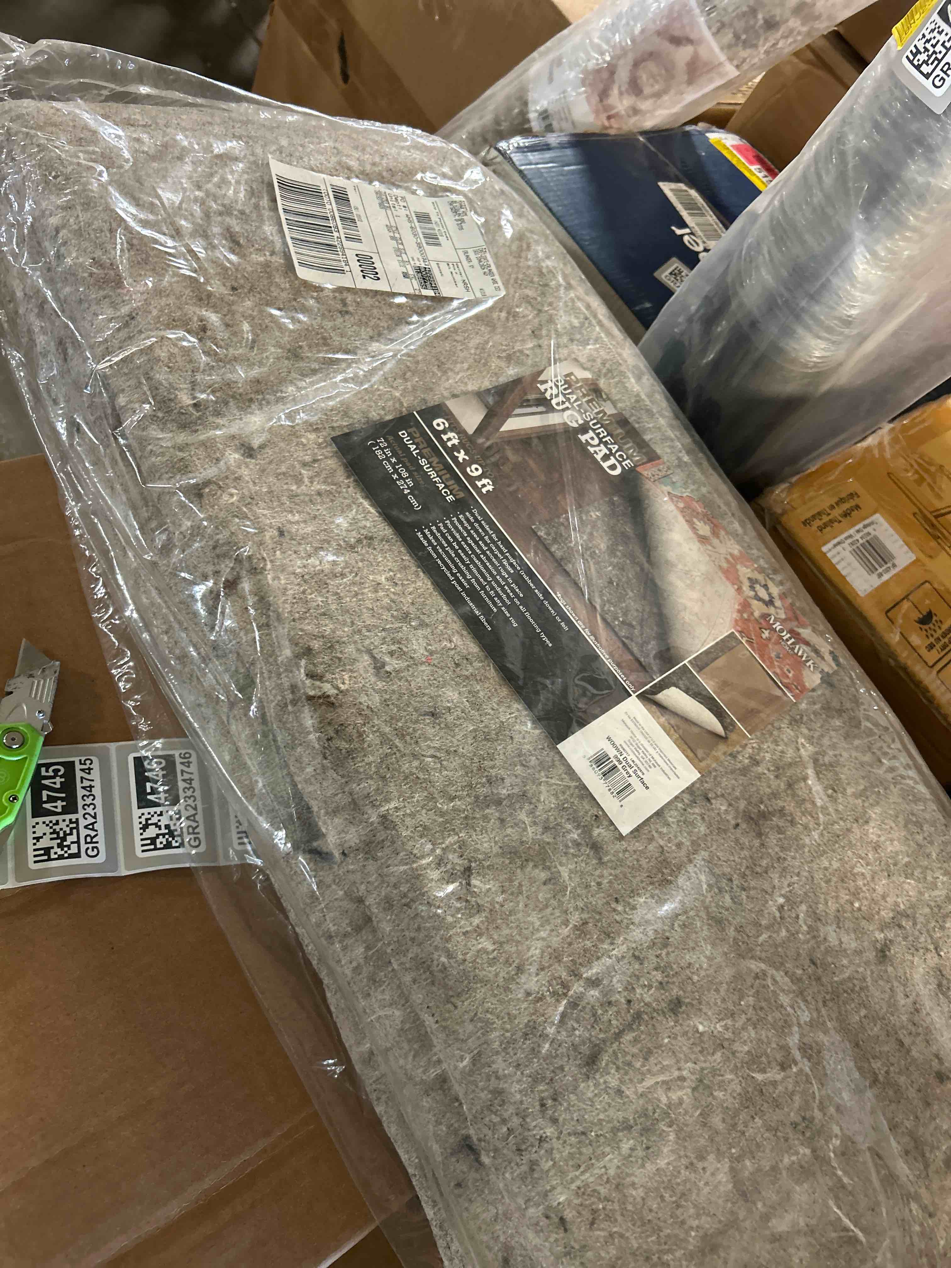 Condition photo showing New/Like New for Mohawk Home 6' x 9' Non Slip Grip Rug Pad 1/4" Thick Dual Surface Felt Cushion + Rubber Gripper - Safe for All Floors 1/4 Inch Dual Surface Rug Pad 6' x 9' (Rectangular)