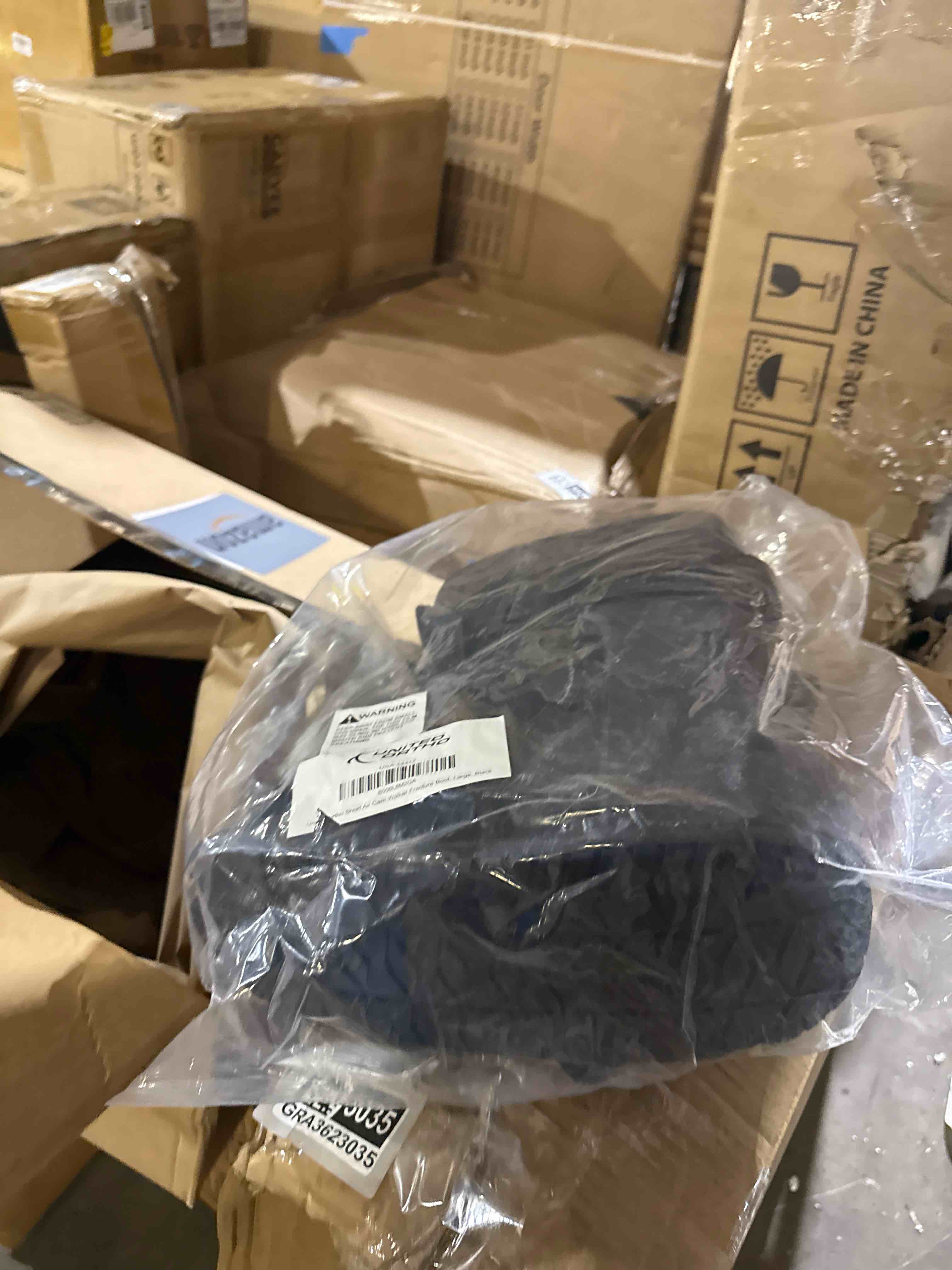 Condition photo showing New/Like New for united ortho short air cam walker fracture boot, large, black black large boot