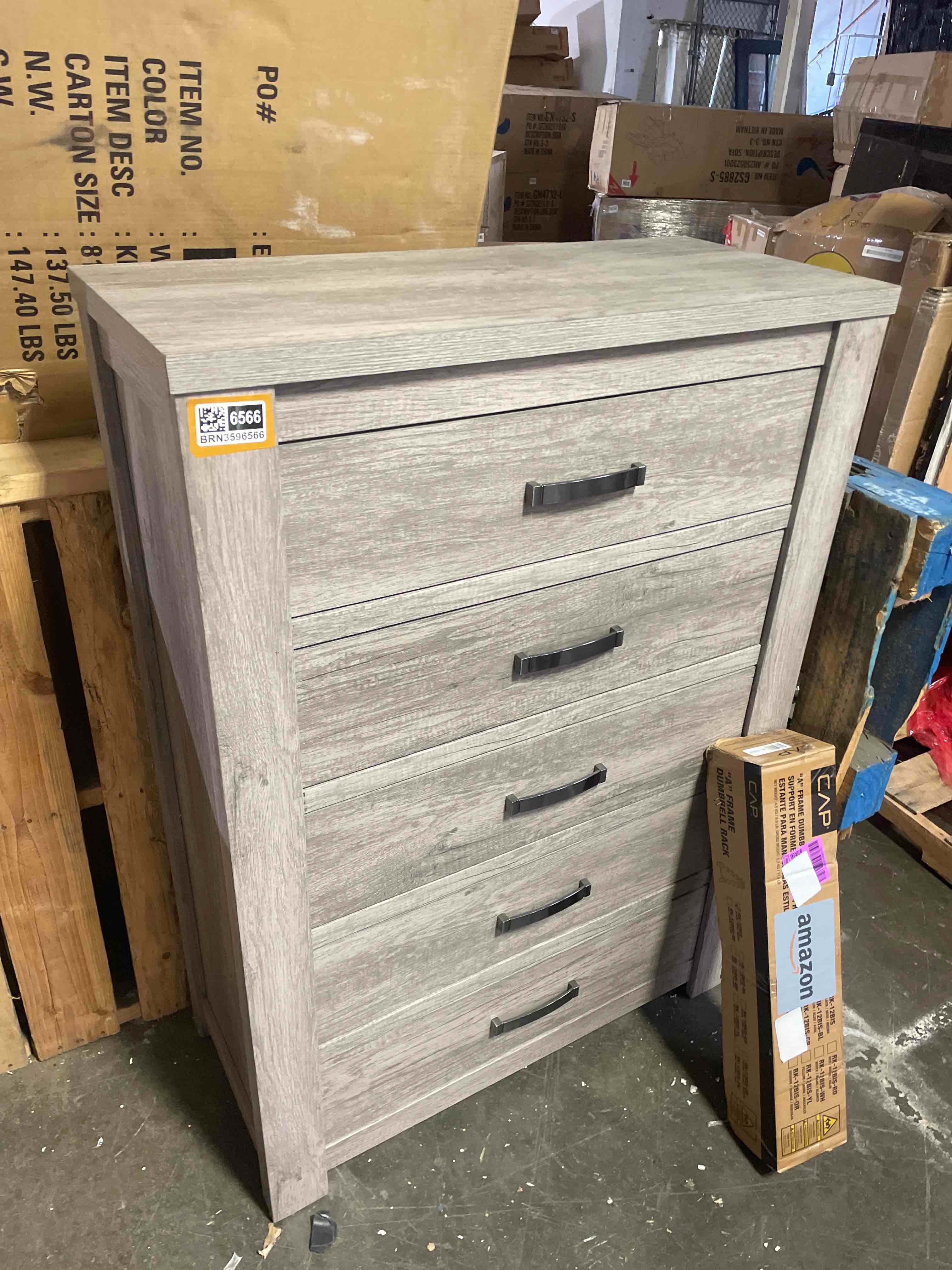 Condition photo showing New/Like New for floren contemporary weathered gray wood 5-drawer chest with a wood grain pattern, drawer fronts have metal pull in brushed nickel, overall dimension: 37"w x 16.65"d x 51.77"h (small damage)