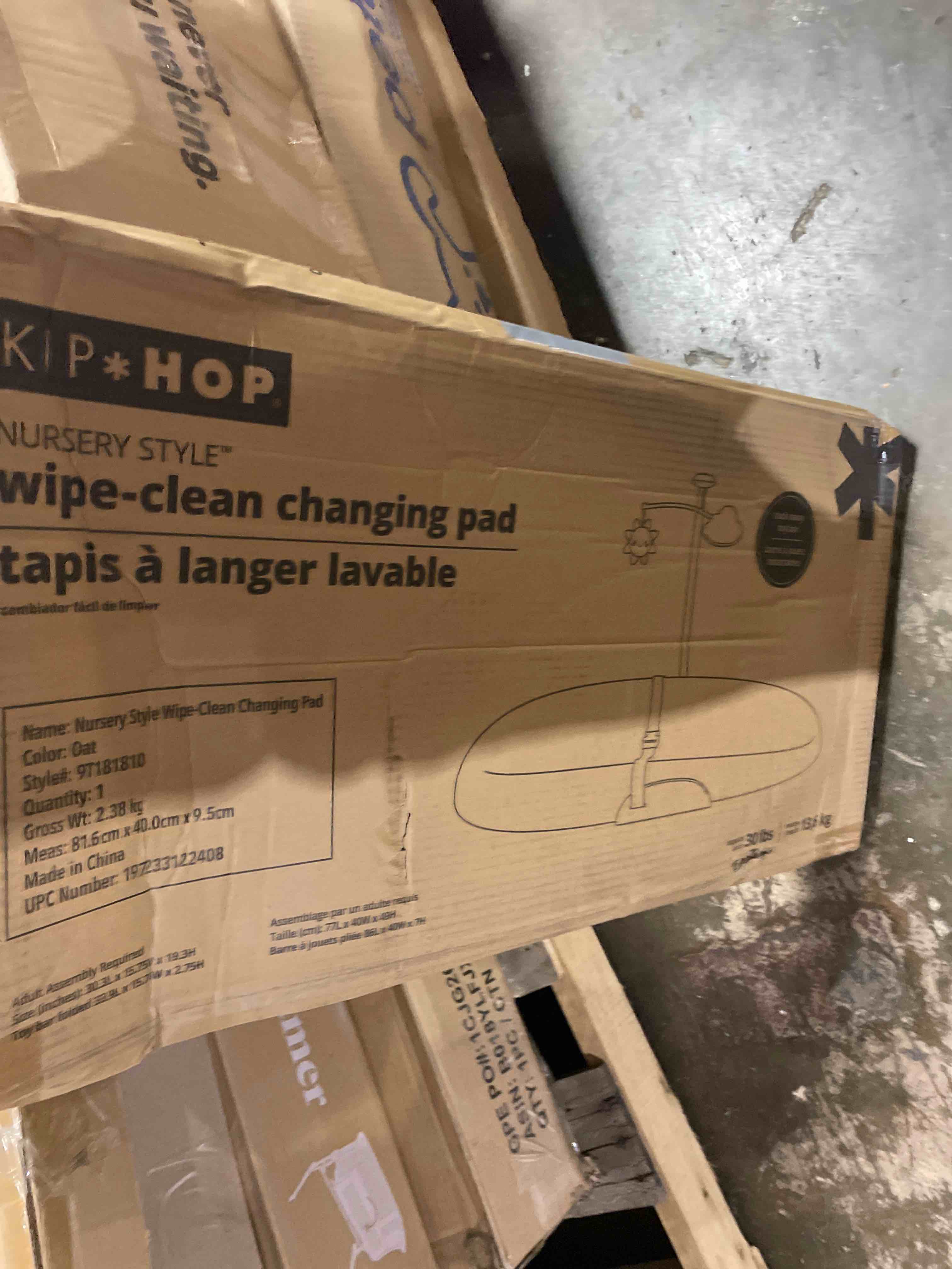 Condition photo showing New/Like New for skip hop baby changing pad nursery style wipe-clean contoured with cushioned foam, non-skid base, built-in safety belt & tuck-away toy bar fits standard changing tables, oat 16" oat