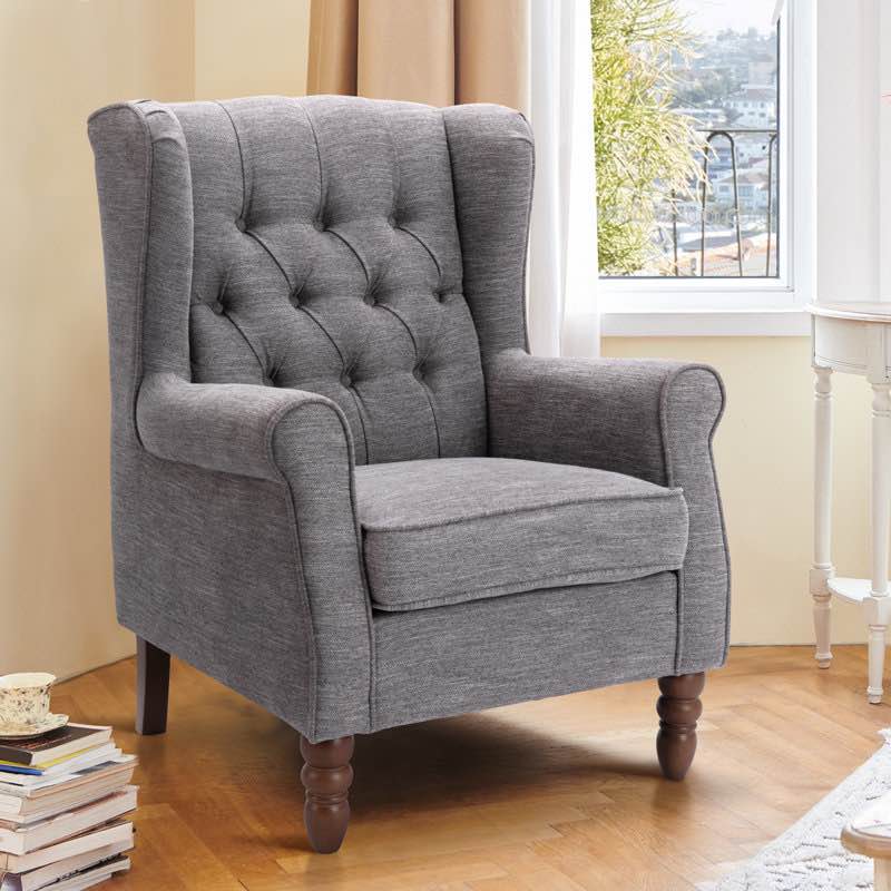 button-tufted small wingback accent chair with rolled arm and thick padded cushion