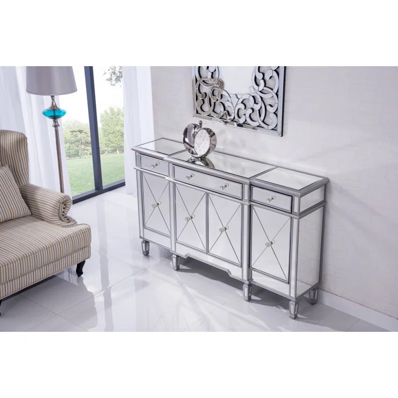 Calia 3 Drawer Mirrored Sideboard with 3 Shelved Cabinets, Minor cosmetic scratching to front, crack on right side mirror, chipped on back left edge, 1 Crystal Knob needs to be replaced, can be beautiful quality dresser or cabinet. 36'' H X 14'' W x 60” D 
