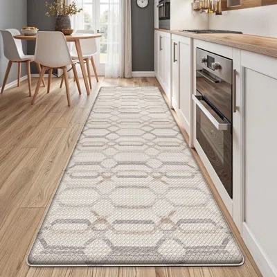 cushioned anti-fatigue kitchen mat featuring a modern, neutral geometric interlocking trellis pattern.