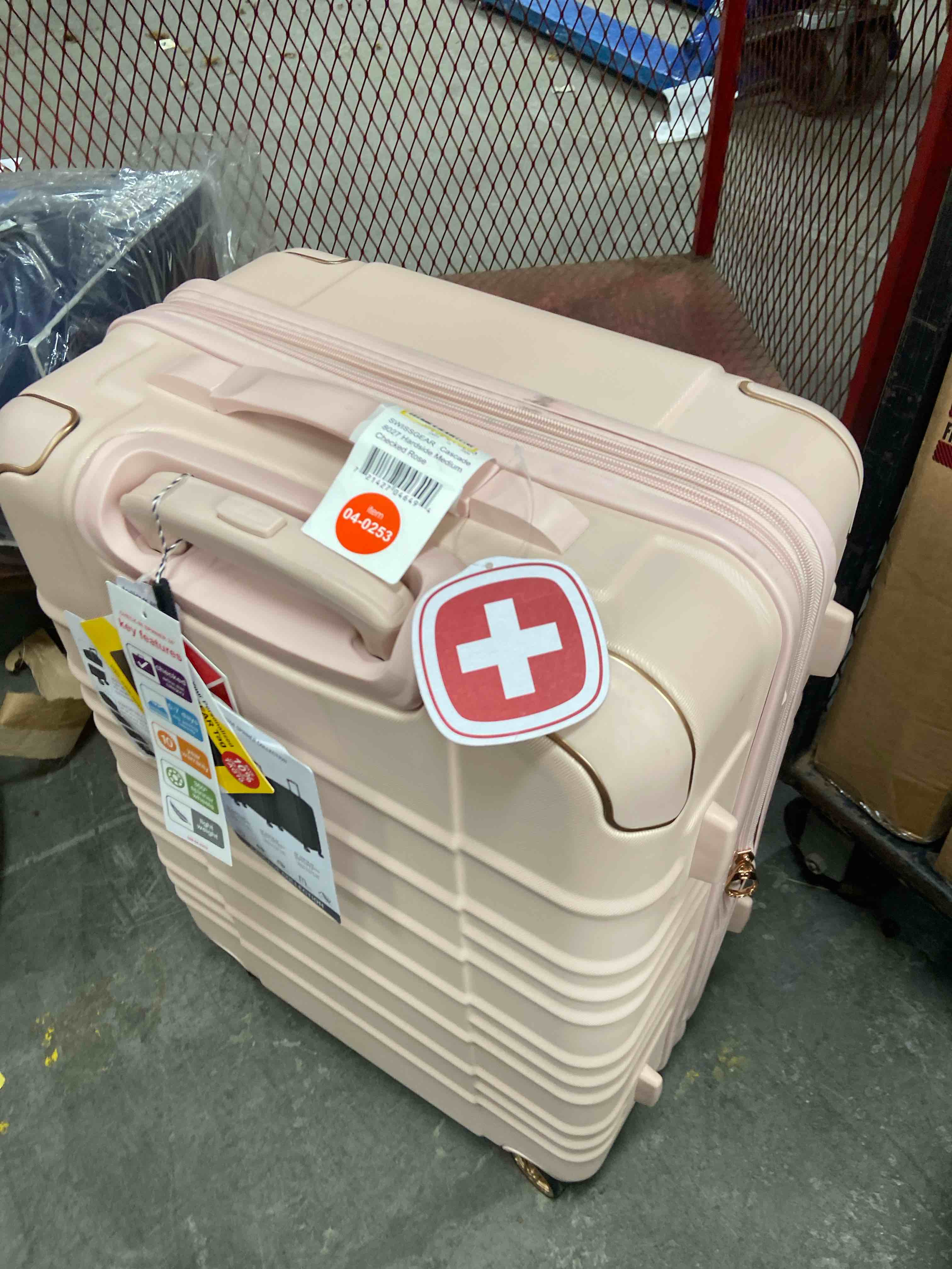 Condition photo showing New/Like New for swissgear cascade ii hardside medium checked spinner suitcase 8 wheel 33 lb capacity - rose