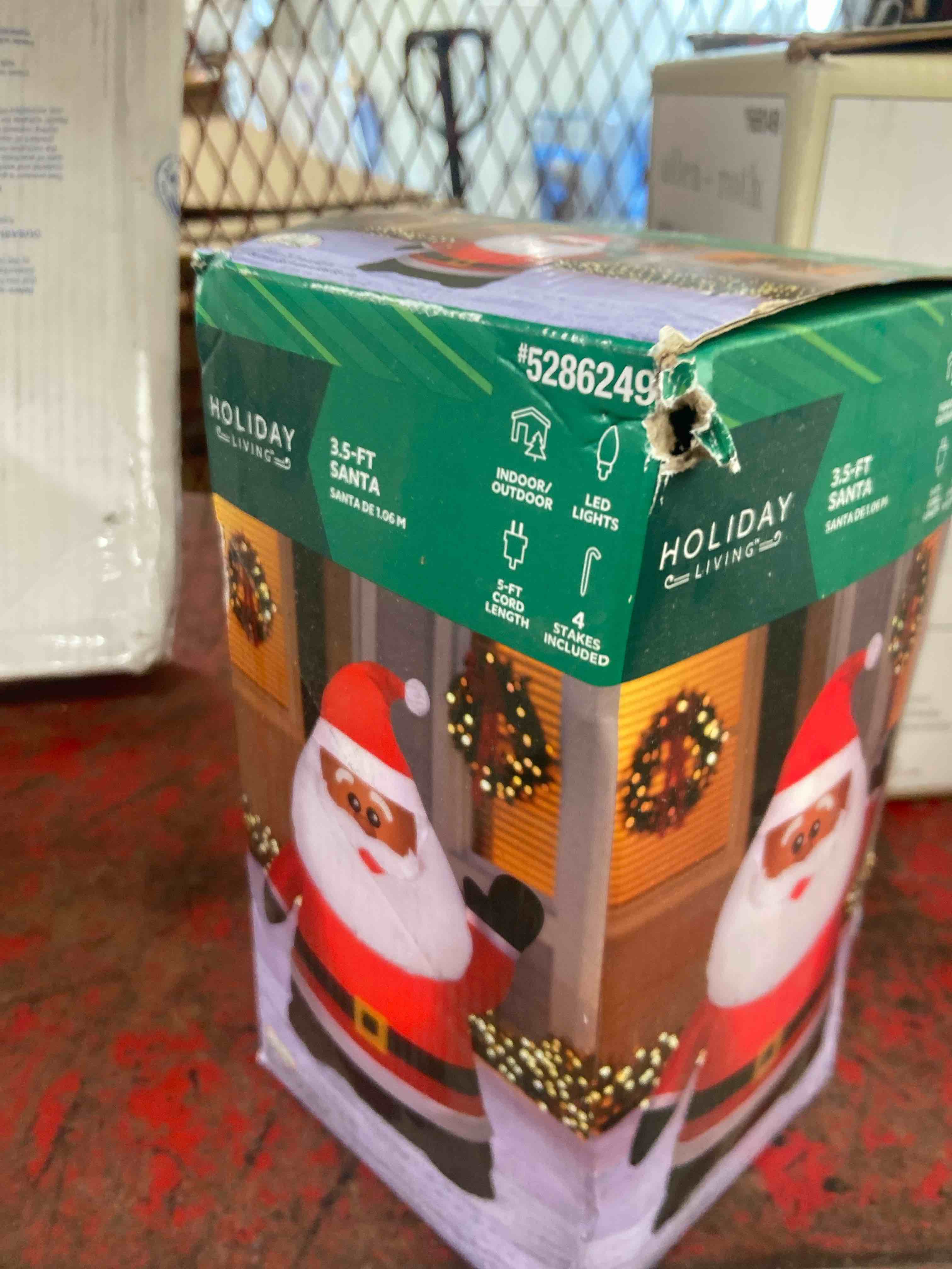 Condition photo showing New/Like New for holiday living 3.5-ft tall pre-lit santa christmas inflatable african american