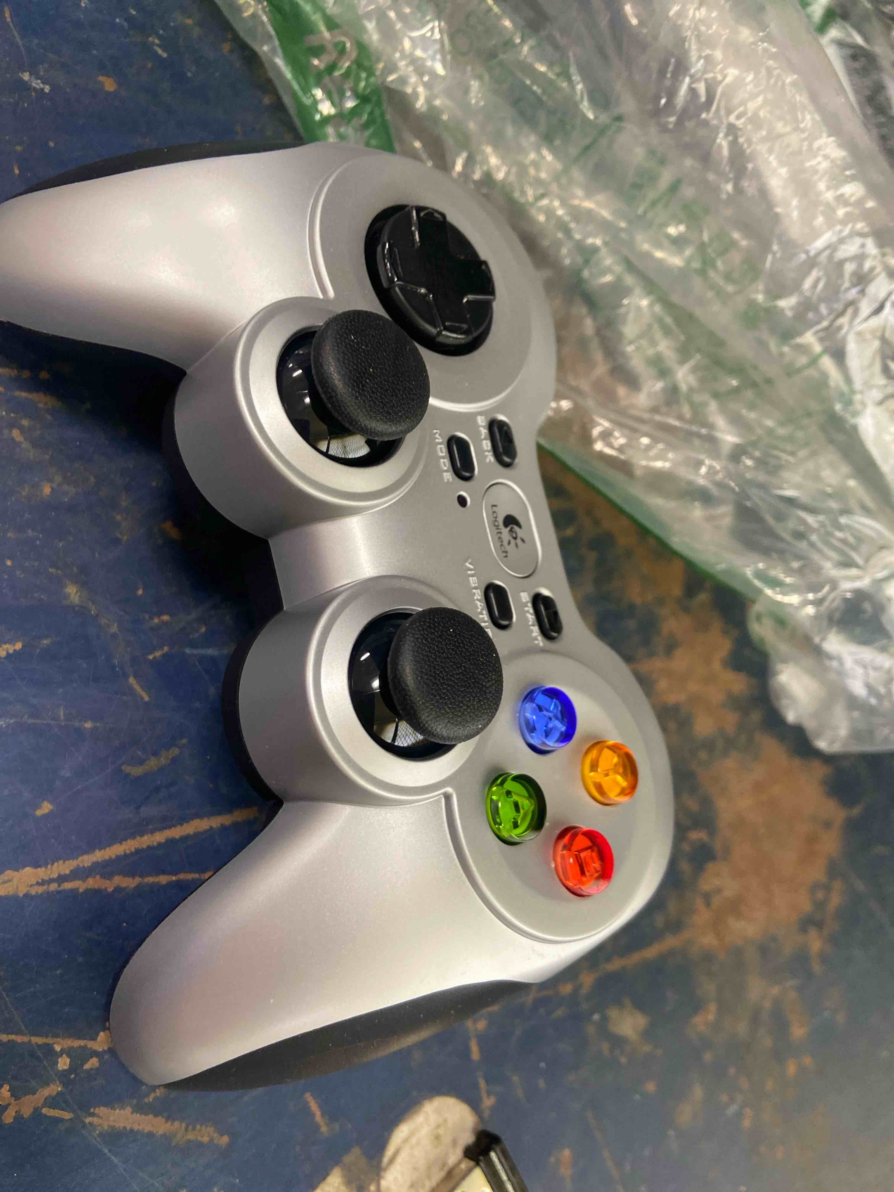 Condition photo showing New/Like New for logitech g f710 wireless gamepad, 2.4 ghz wireless with usb nano-receiver, controller dual vibration feedback, 4 switch d-pad, pc - grey/black gamepad f710