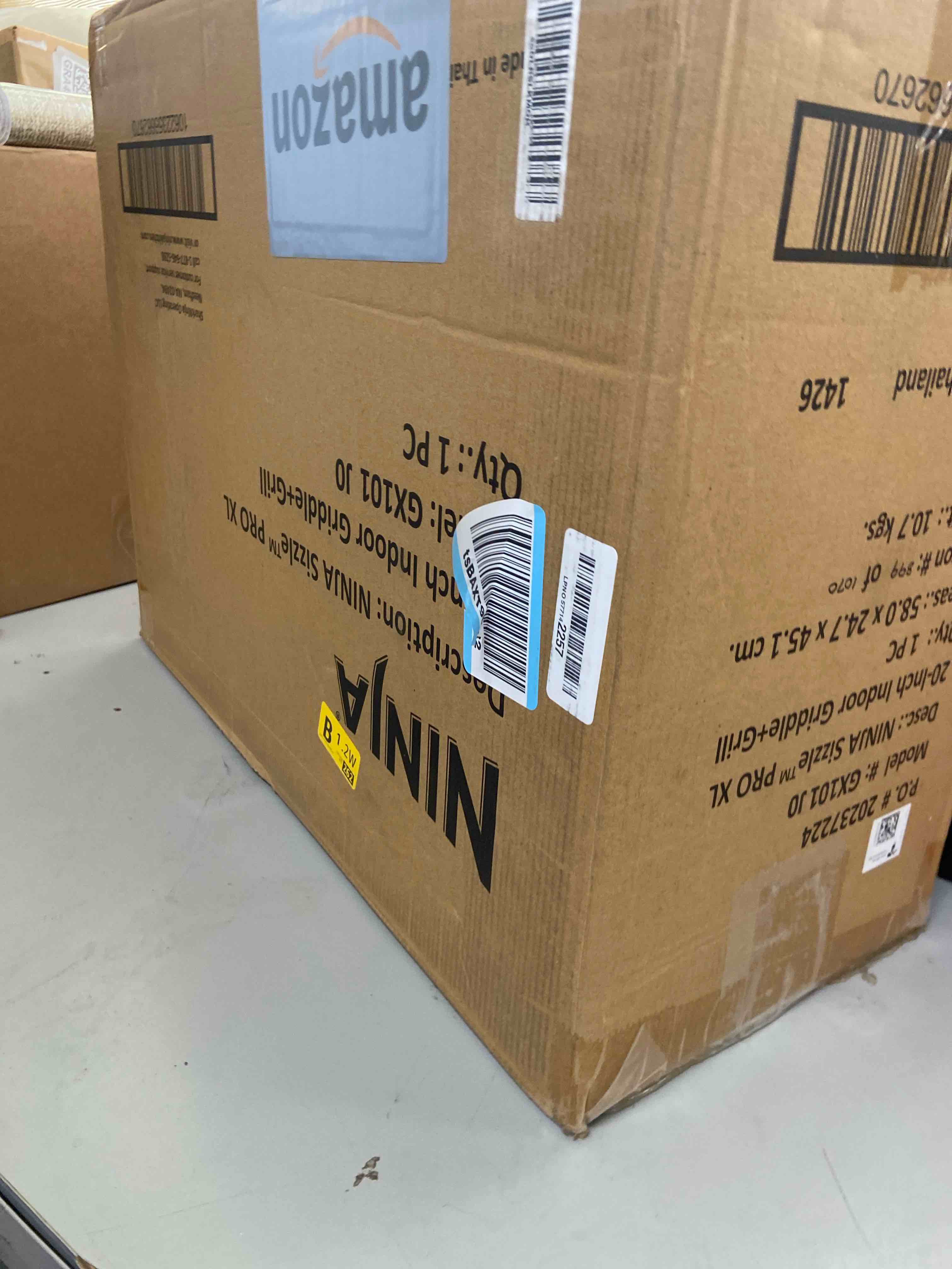 Condition photo showing New/Like New for ninja sizzle pro xl 8-serving electric indoor griddle & grill 20-inch plates edge-to-edge heating gx101 silver