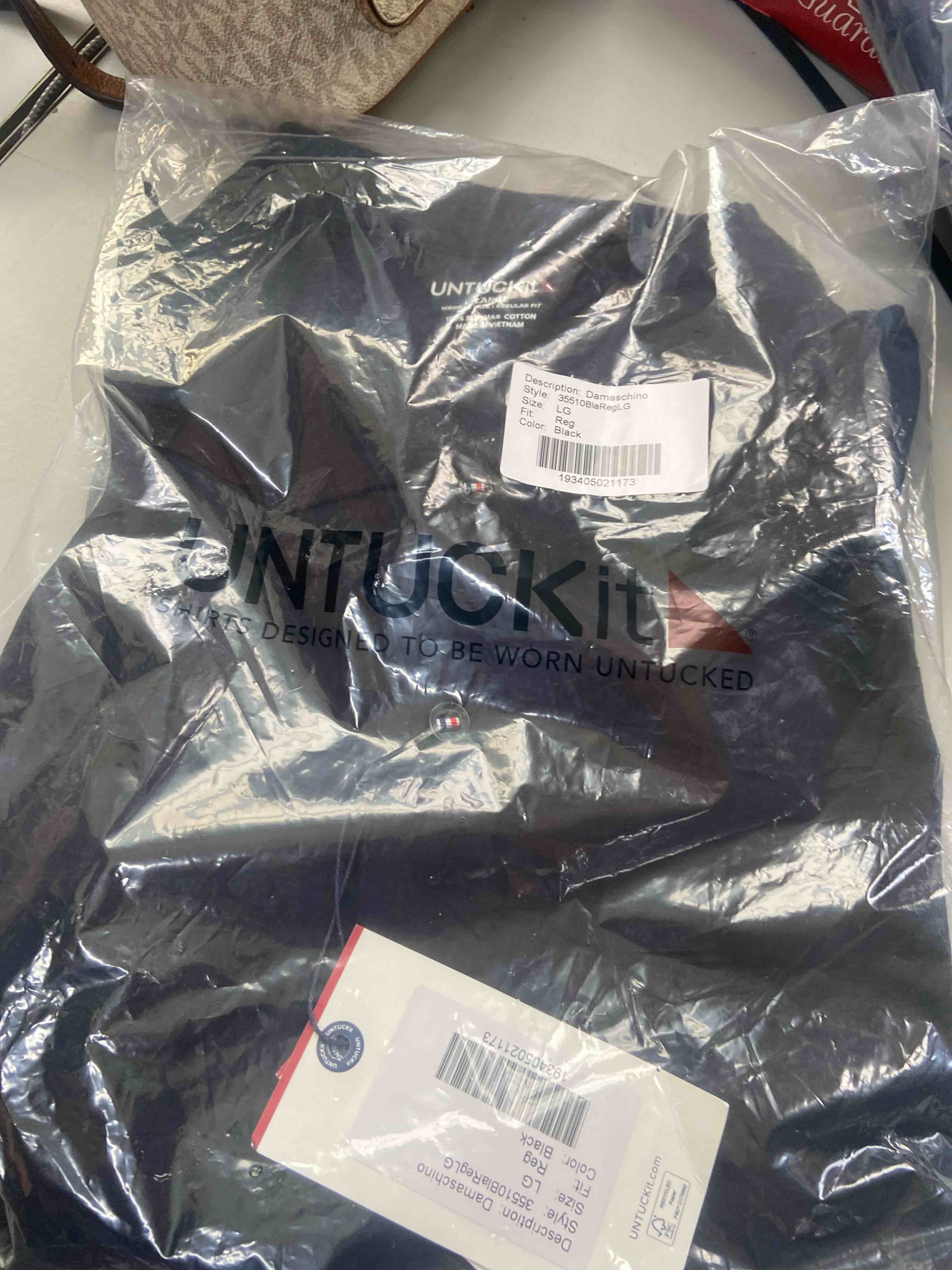 Condition photo showing New/Like New for untuckit short sleeve wrinkle free supima cotton polo shirts for men