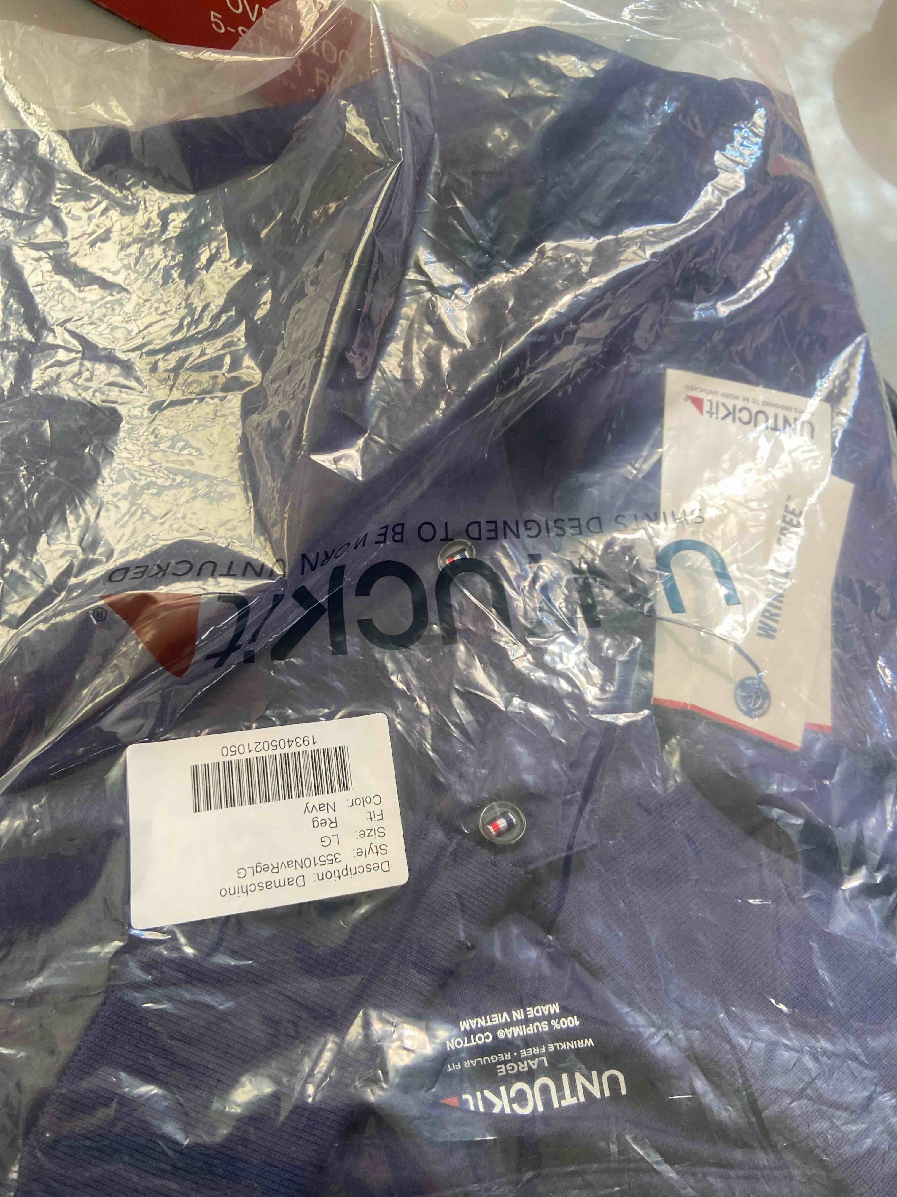 Condition photo showing New/Like New for untuckit wrinkle-free damaschino polo (navy) men's long sleeve button up