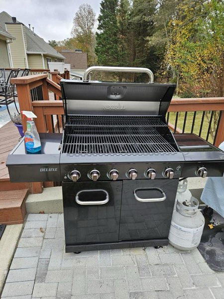 Nexgrill Deluxe 5-Burner Propane Barbecue Gas Grill with Side Table and Ceramic Searing Side Burner, 771 sq. in., 75000 BTUs, Black, Outdoor Cooking, Patio, Barbecue Grill, 720-1046A- BOTTOM EDGE BENT SLIGHTLY