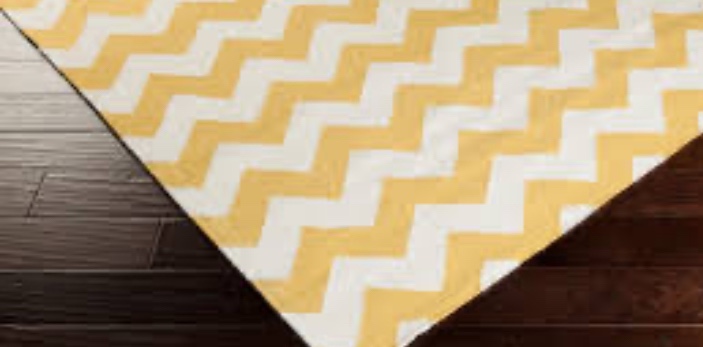 Yellow and cream colored rug 4x6