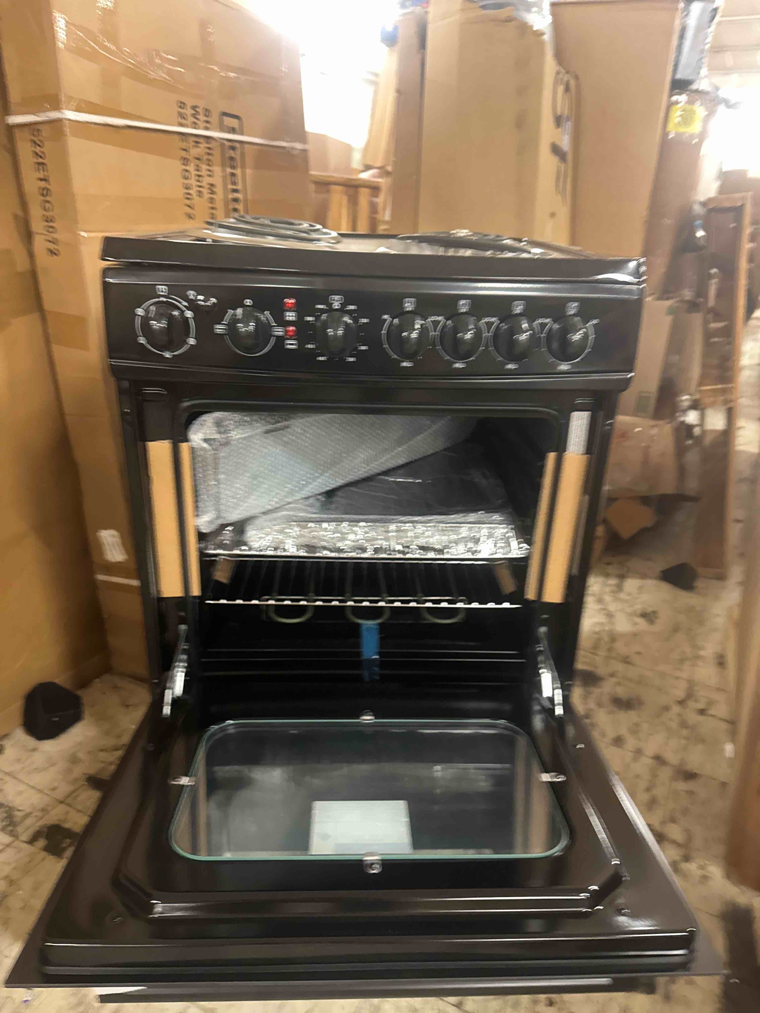 Condition photo showing Good Condition for avanti electric range oven compact design, 2.6-cu.ft. capacity with 4 coil burners, framed glass oven door, storage drawer and broiler with pan perfect for apartment rv tiny home, 24-inch, black (dent along right side, will not be visible if it's going to slide into an existing space such a rv counter it would not be visible if that visible then.,see photos.)