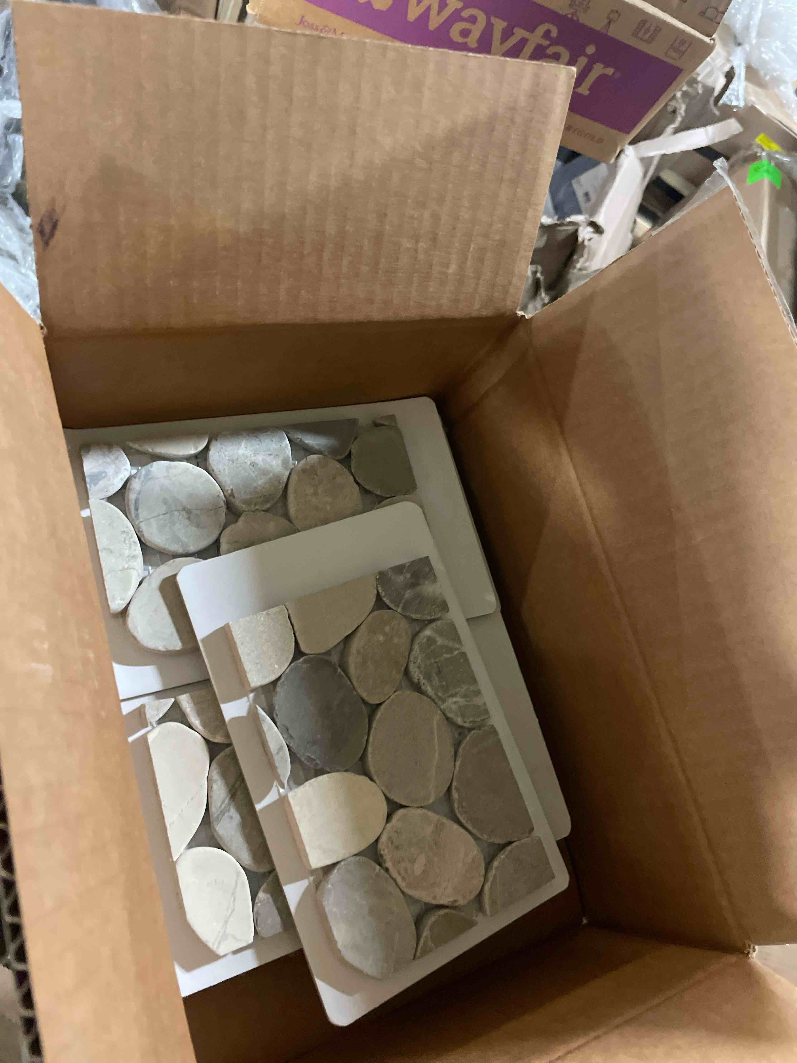 Condition photo showing New/Like New for pale sliced pebble mosaic, tumbled stone backsplash tiles for kitchen walls, shower and bathroom floors, and outdoor areas (12" x 12")