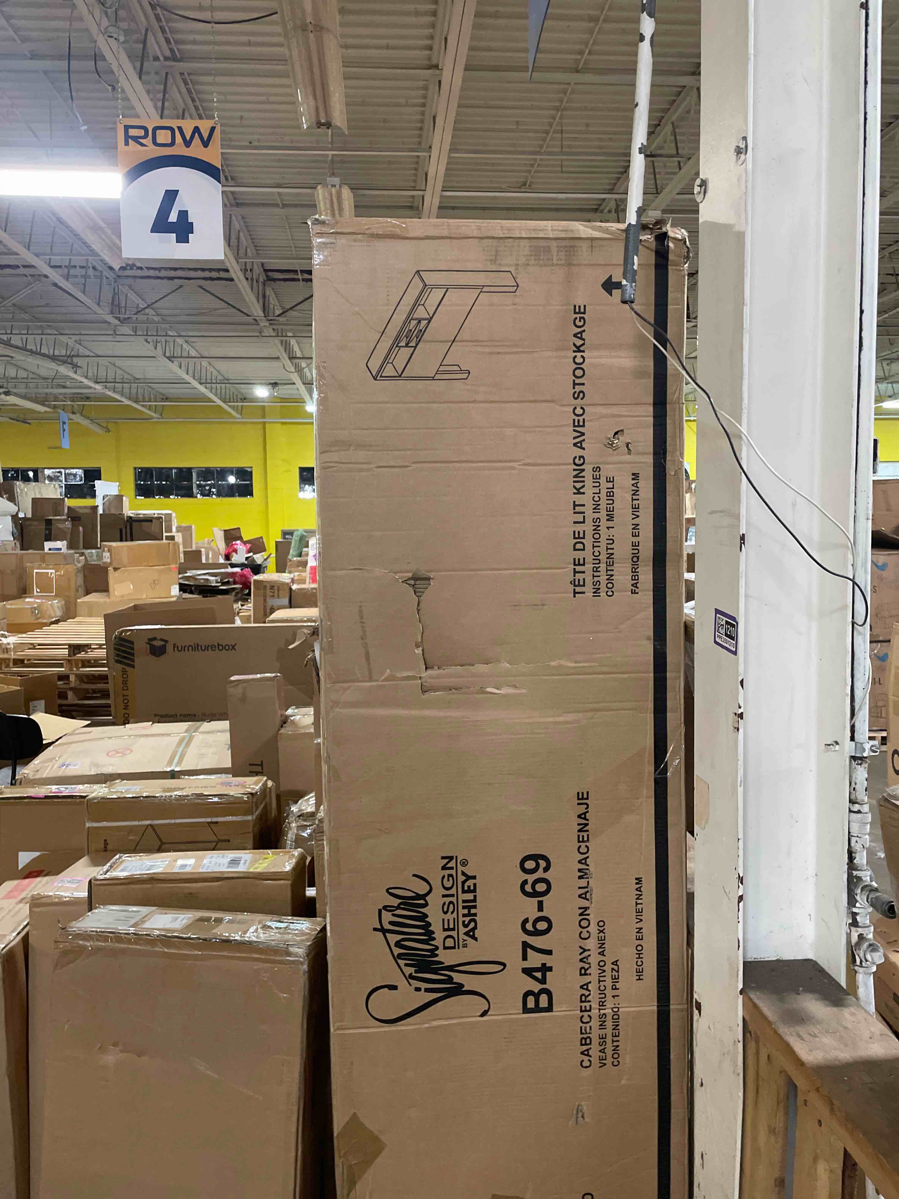 Condition photo showing As Is for b476-69-66-99 caitbrook collection king size bed with storage drawers  decorative hardware  engineered wood construction  bookcase  low profile (only headboard) 