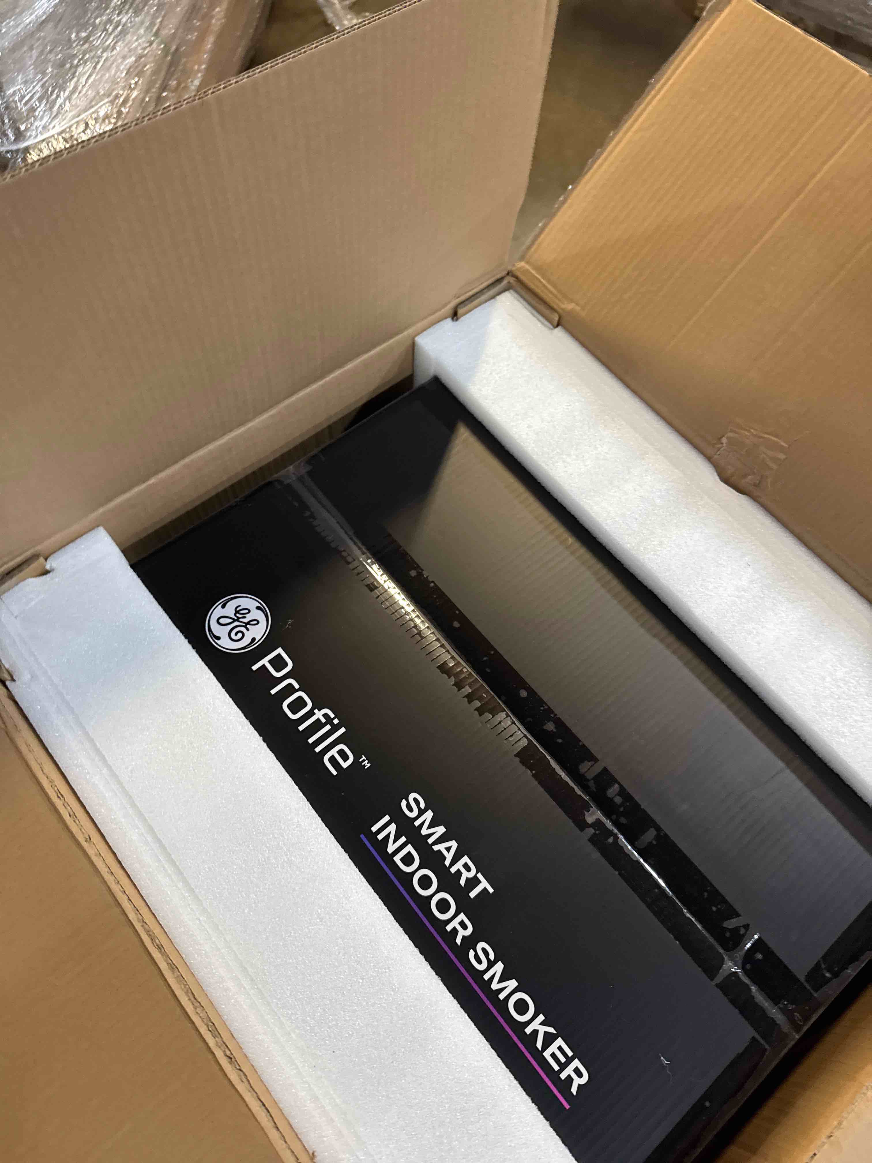 Condition photo showing New/Like New for GE Profile™ Smart Indoor Pellet Smoker, with Active Smoke Filtration, 5 Smoke Control Settings, WiFi Connected, Electric, Countertop BBQ Appliance, Black