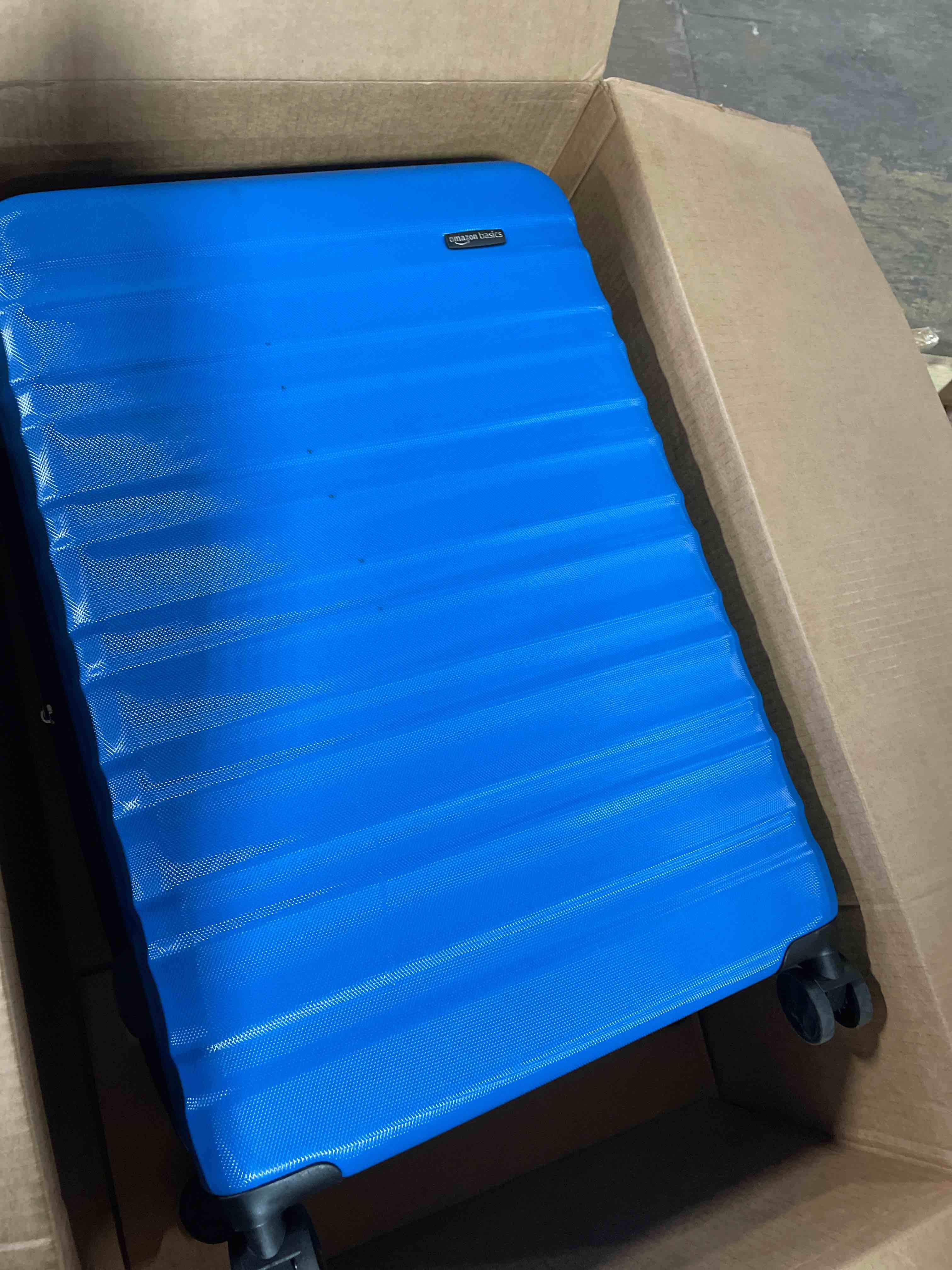 Condition photo showing Good Condition for Amazon Basics 21" Hardside Carry-On Luggage, Hardshell Suitcase With Wheels, Expandable For Up to 25% More Space, With Scratch-Resistant Surface, Four Multi-directional Wheels, Light Blue Light Blue Carry-On