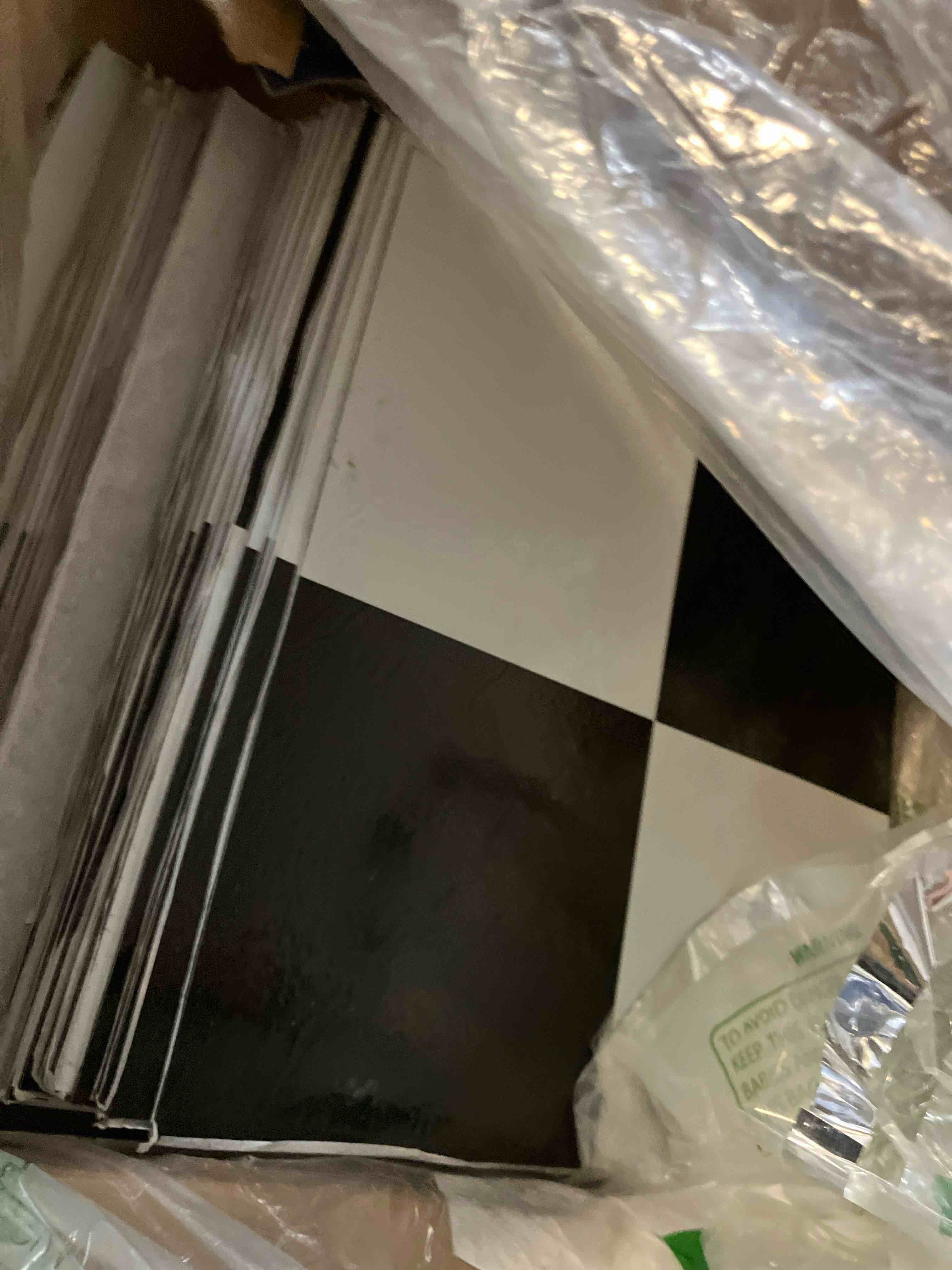 Condition photo showing Good Condition for Tivoli Self Adhesive Vinyl Floor Tiles, 45 Tiles - 12" x 12", Black & White - Peel & Stick, DIY Flooring for Kitchen, Dining Room, Bedrooms, Basements & Bathrooms by Achim Home Decor Black/White