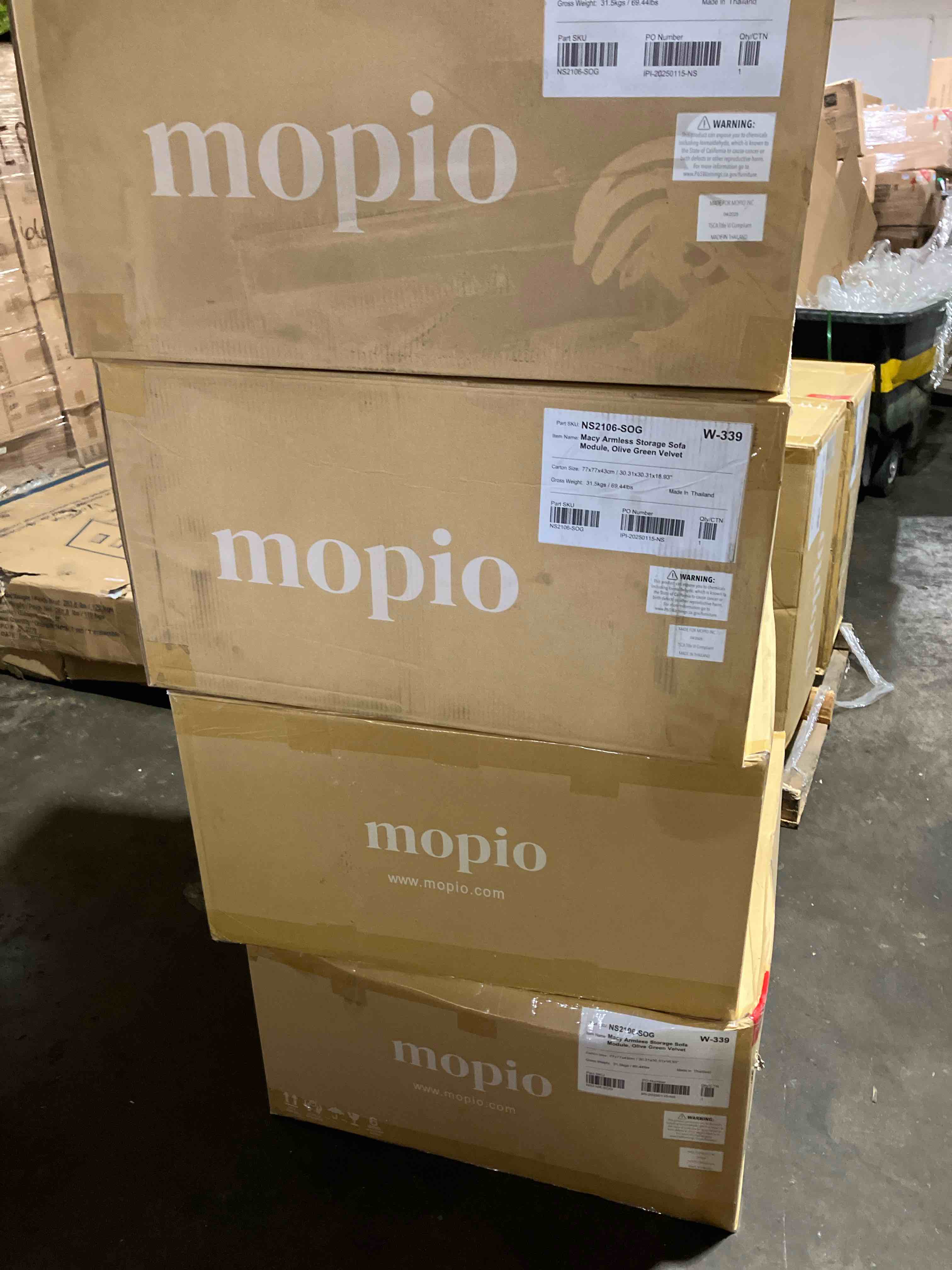 Condition photo showing New/Like New for macy armless 4 seater modular sofa in a olive green velvet upholstery, brand new in box, 4 boxes total