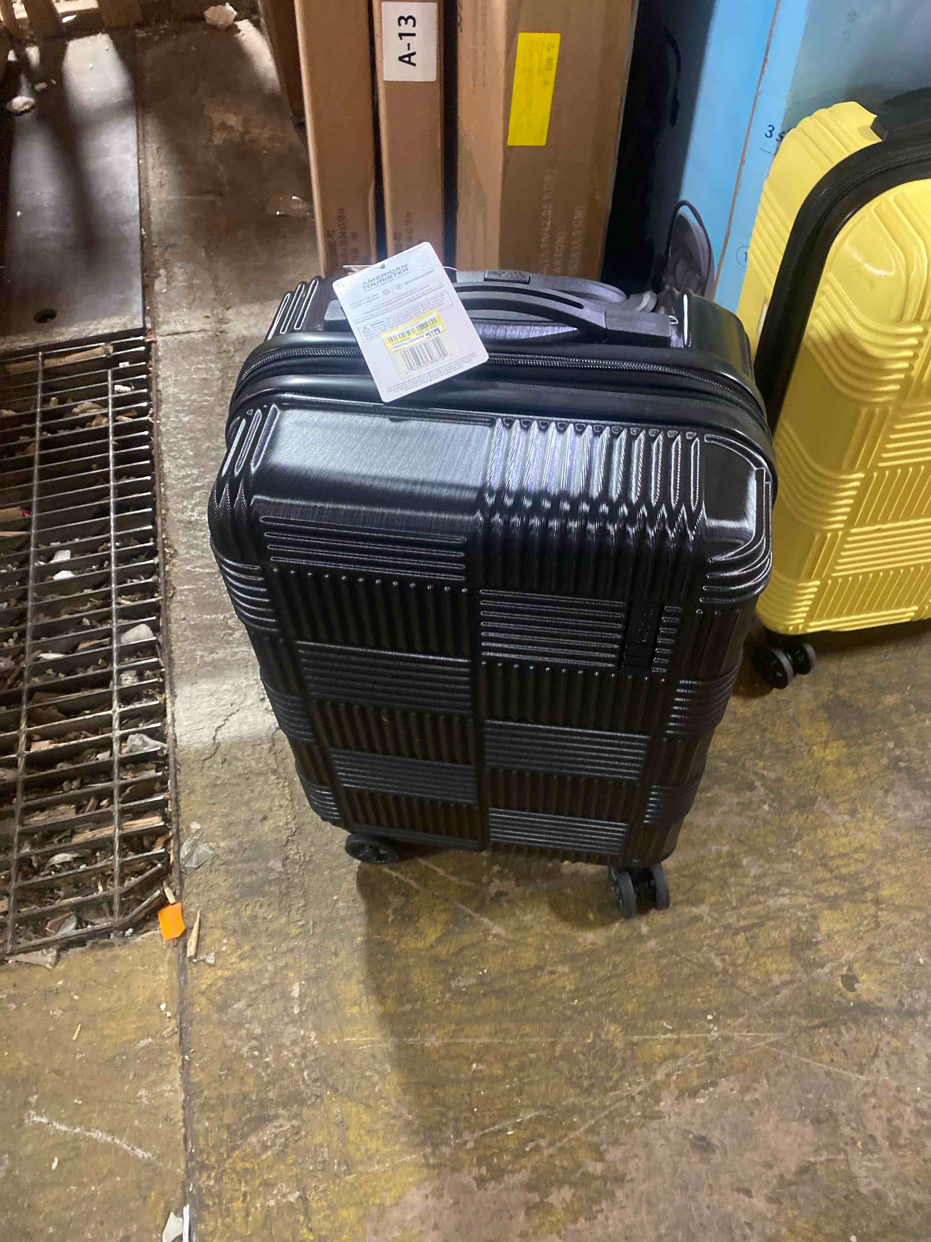Condition photo showing New/Like New for american tourister nxt checkered hardside carry on spinner suitcase - blackout