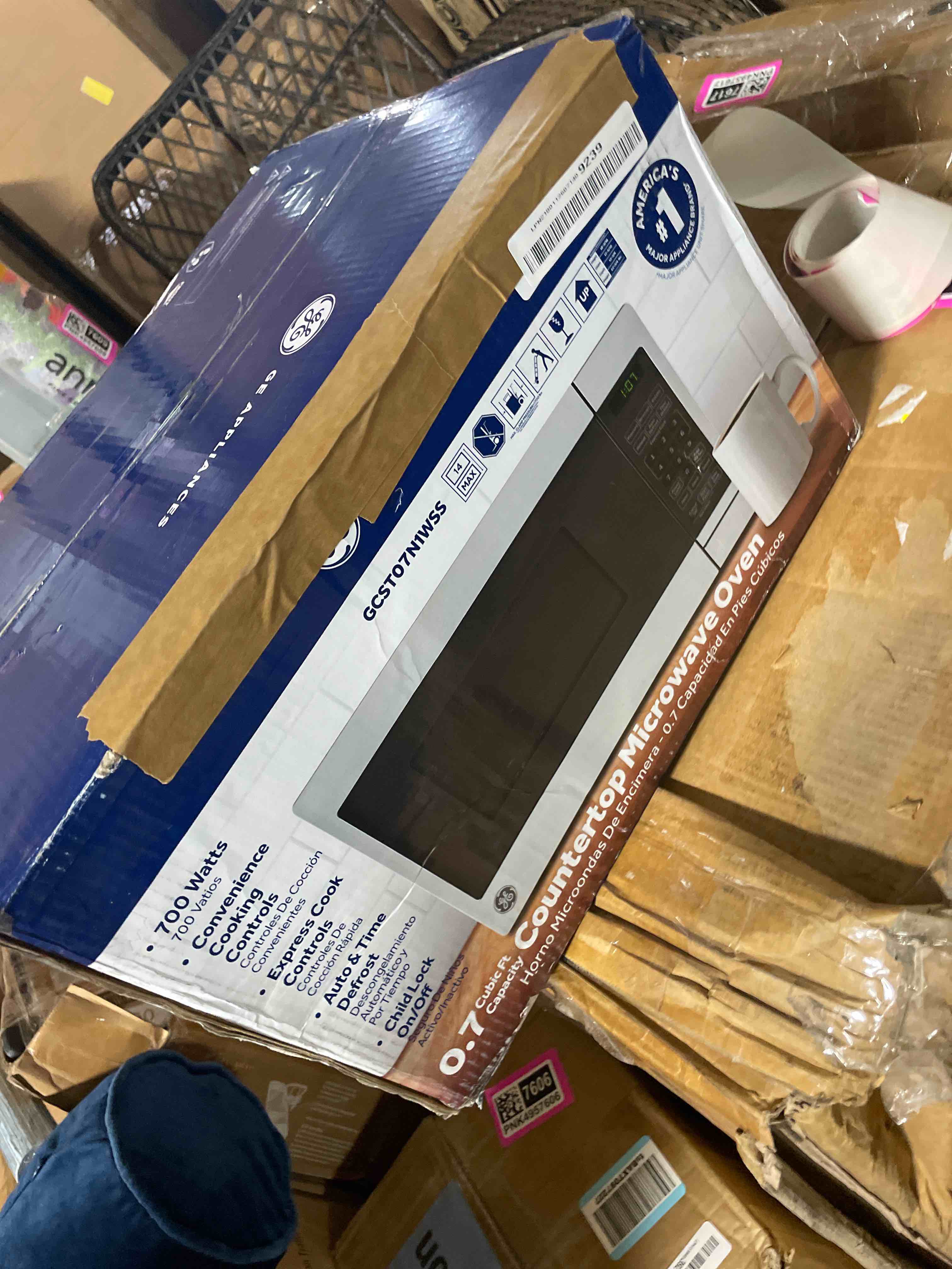Condition photo showing As Is for ge 4-in-1 countertop microwave oven, 1.0 cu ft, 1050w convection microwave with air fry & broil, compact and quiet, stainless steel, ideal for apartments, dorms & offices, gcst10a1wss