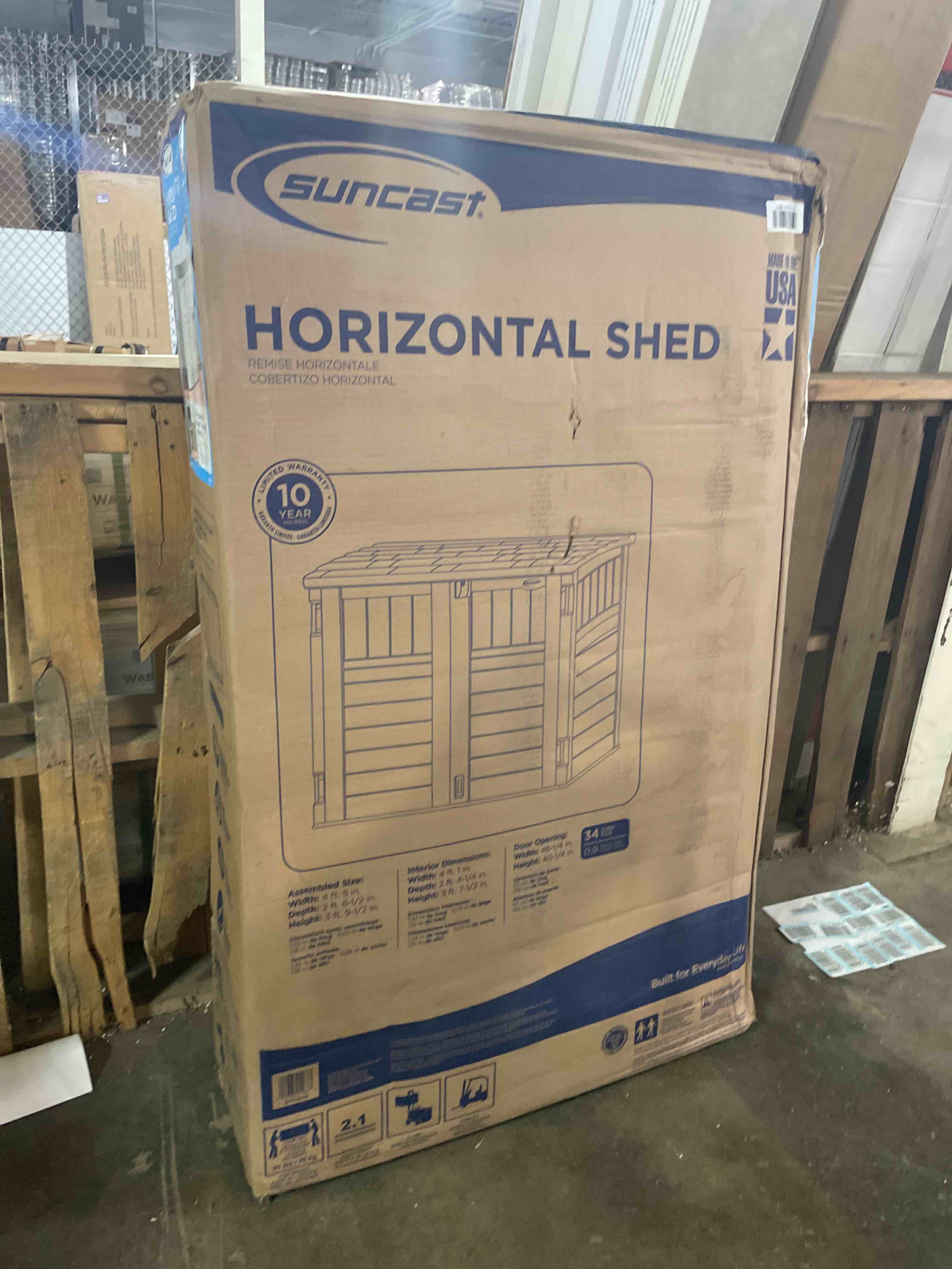 Condition photo showing Good Condition for suncast 34 cu ft horizontal resin storage shed - outdoor storage shed with floor included, lockable, weatherproof, fits small to medium trash cans, generators, & garden tools, vanilla stoney