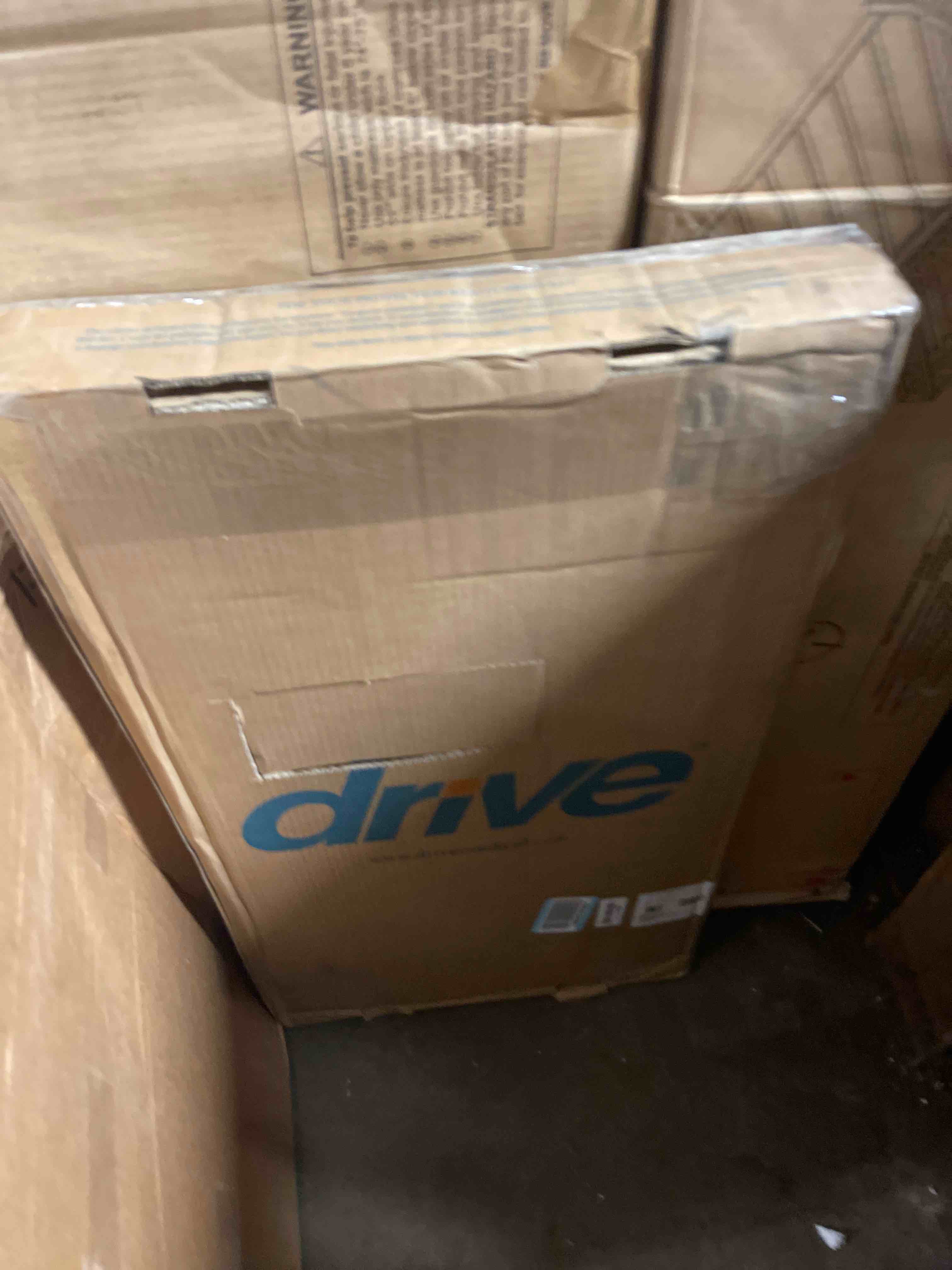 Condition photo showing New/Like New for drive medical overbed table with wheels - secure height adjustment for comfort - non tilt surface - smooth rolling design - home & hospital use - woodgrain laminate top - silver vein silver vein table