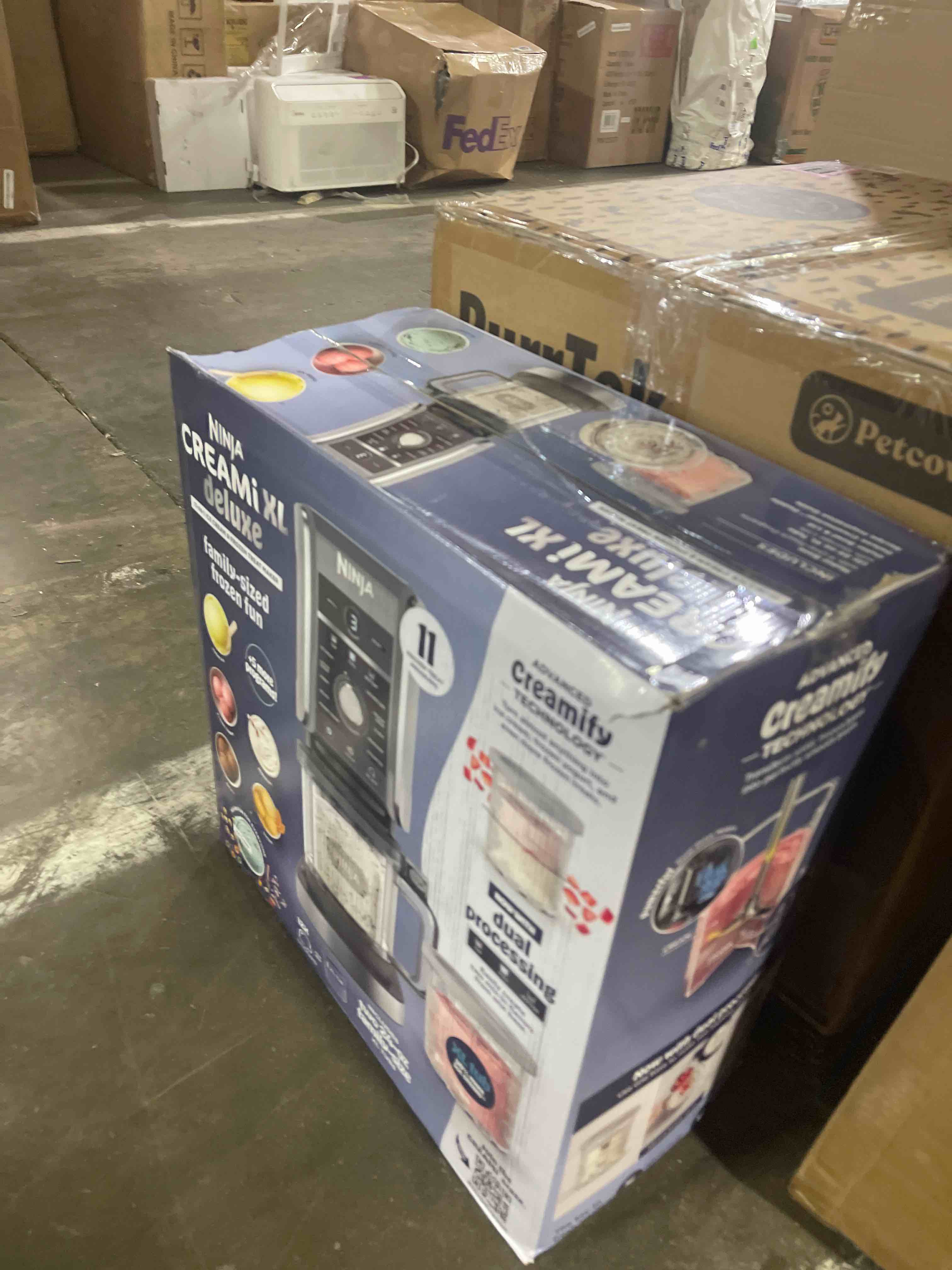 Condition photo showing New/Like New for ninja creami deluxe ice cream maker, treats and frozen desserts, sorbet, milkshakes, yogurt and more, 11-in-1 programs, xl capacity, includes two 24-oz family-size tubs, silver, nc501