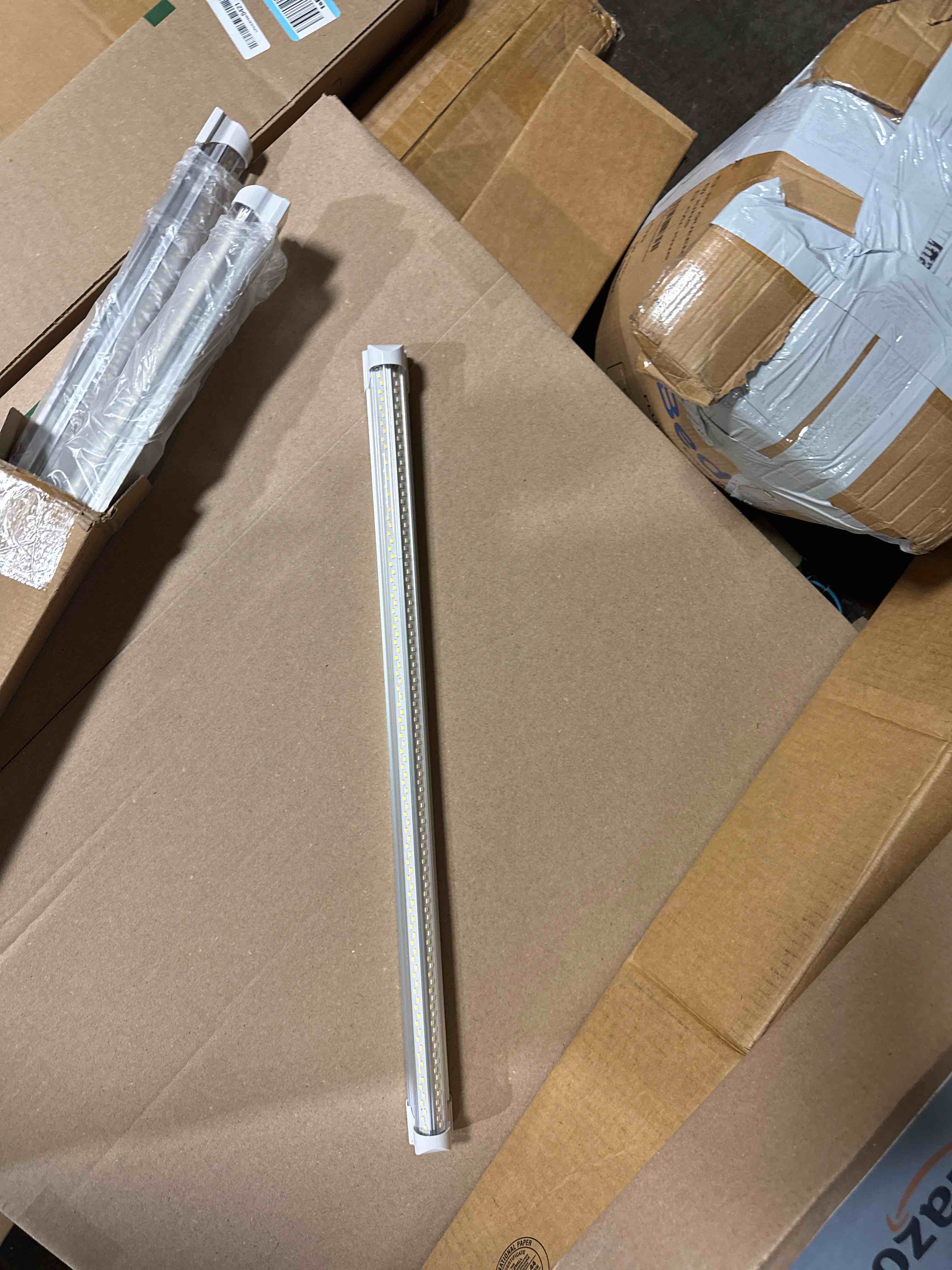 Condition photo showing New/Like New for barrina t8 led shop lights 8ft, 100w 15000lm 5000k, 4 pack, high output | 8 foot for garage workshop and workbench use, easy clip ceiling mount, linkable to 3, v shape, aluminum, clear cover