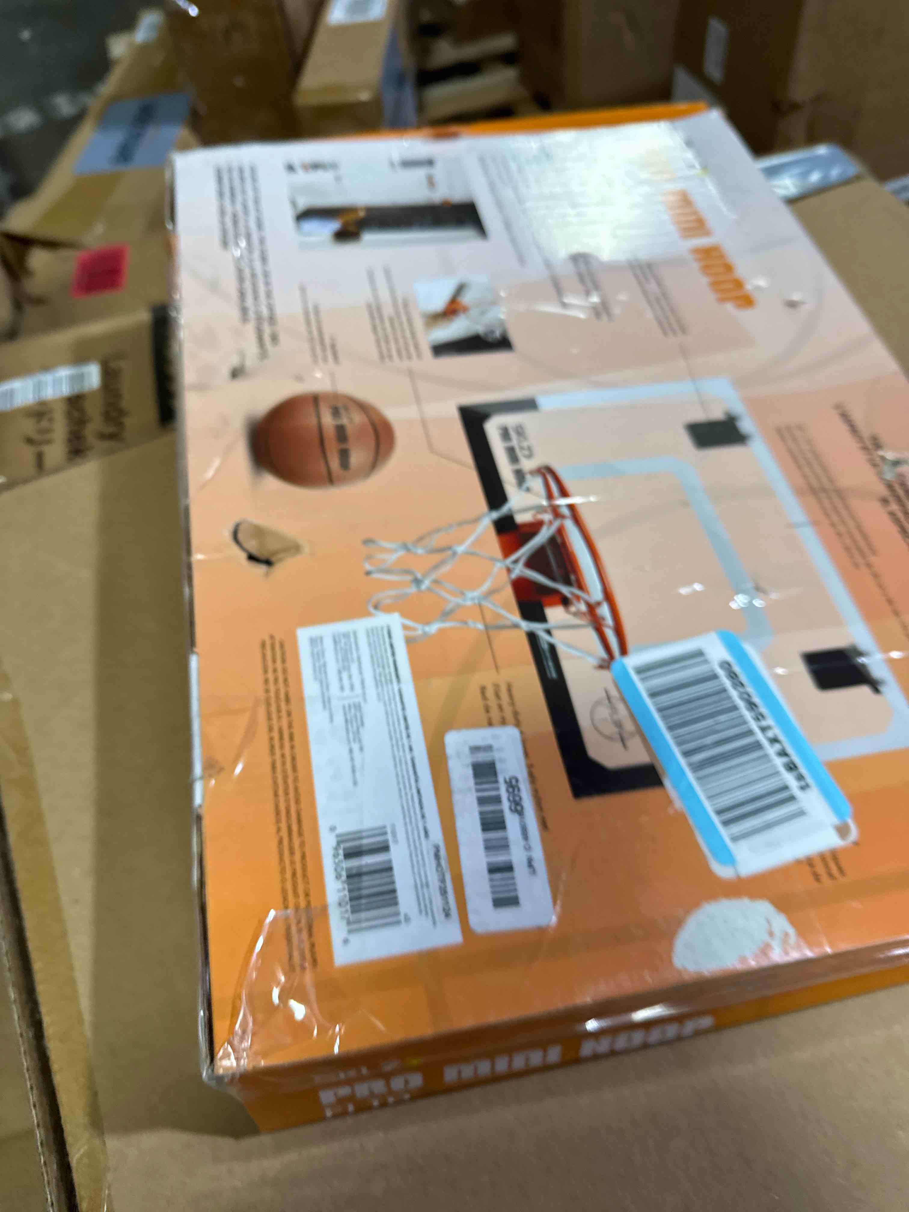Condition photo showing New/Like New for sklz pro mini indoor basketball hoop with ball, over the door, shatter-proof backboard, spring-action break-away steel rim, great for home, dorm room, and office standard