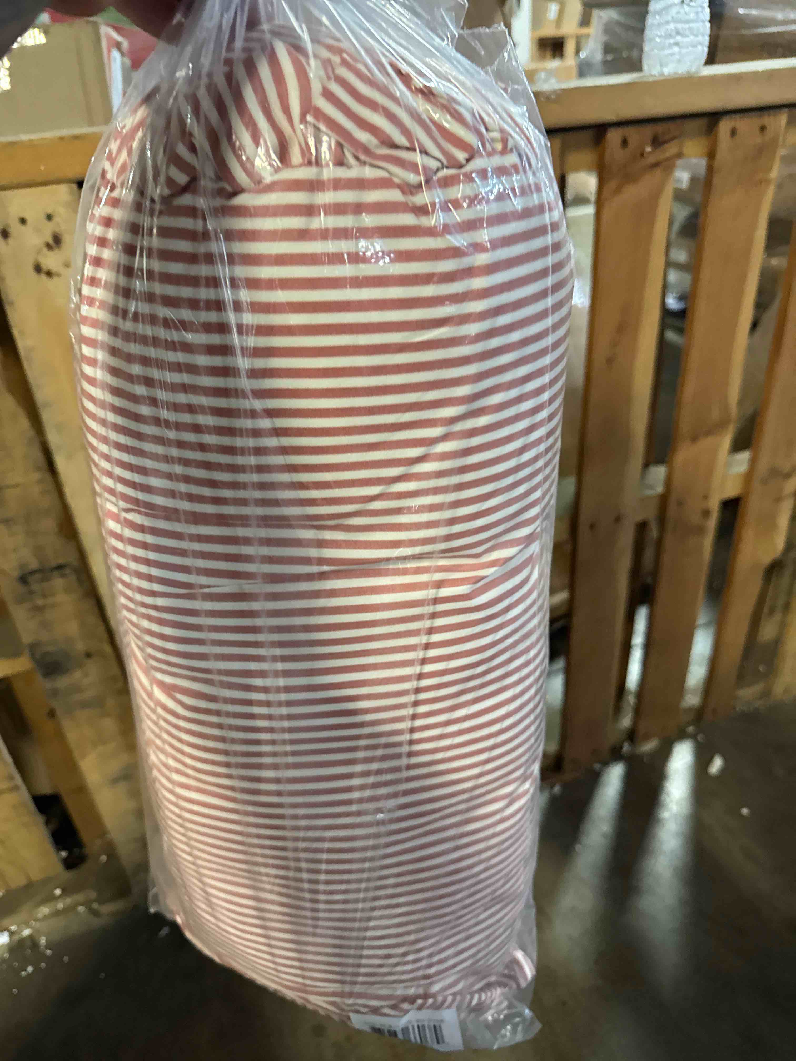 Condition photo showing New/Like New for home decor collection 8 x 20 pink striped ruffle bolster decorative pillow