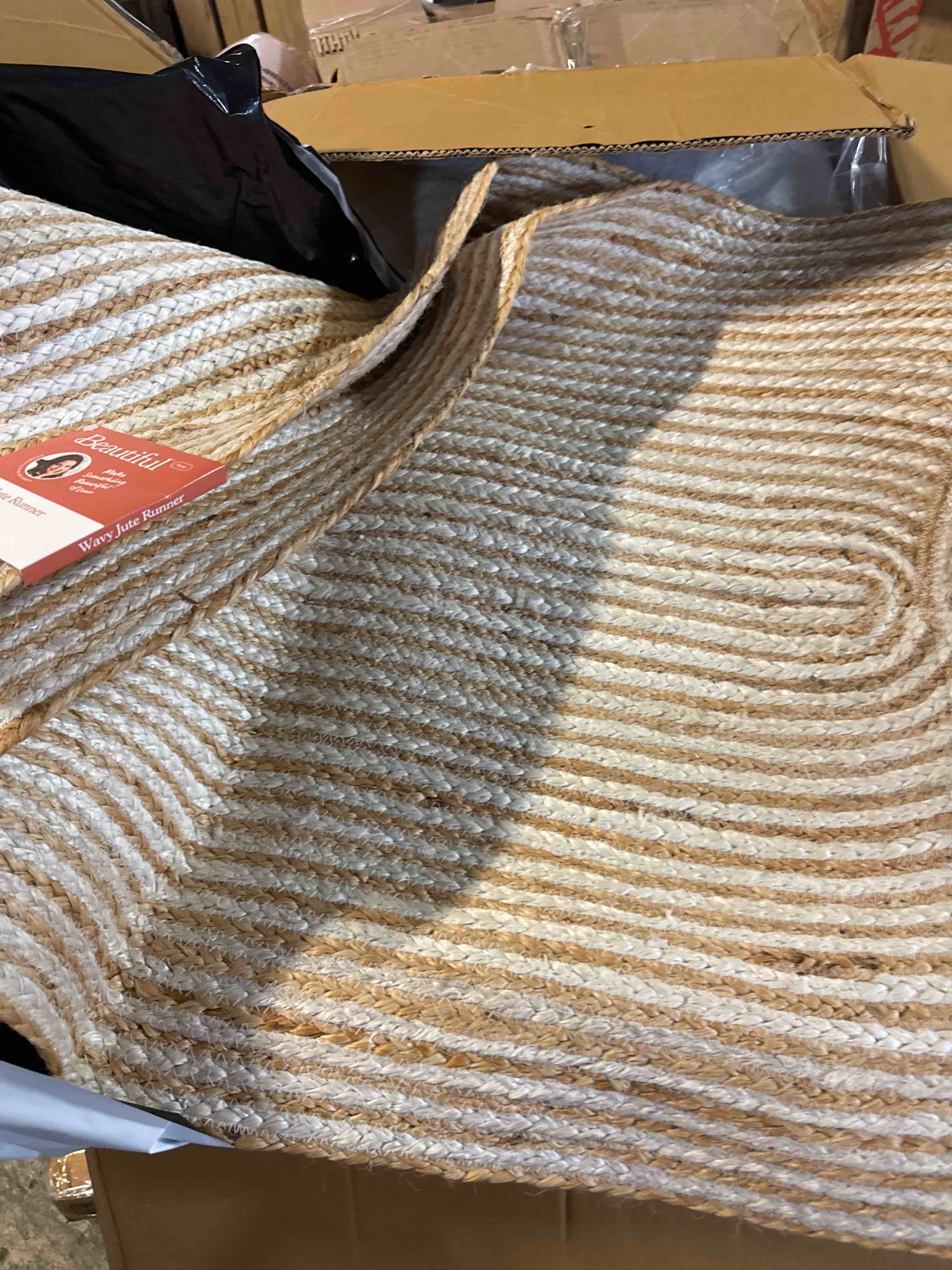 Condition photo showing New/Like New for beautiful natural braided jute indoor scatter rug by drew barrymore