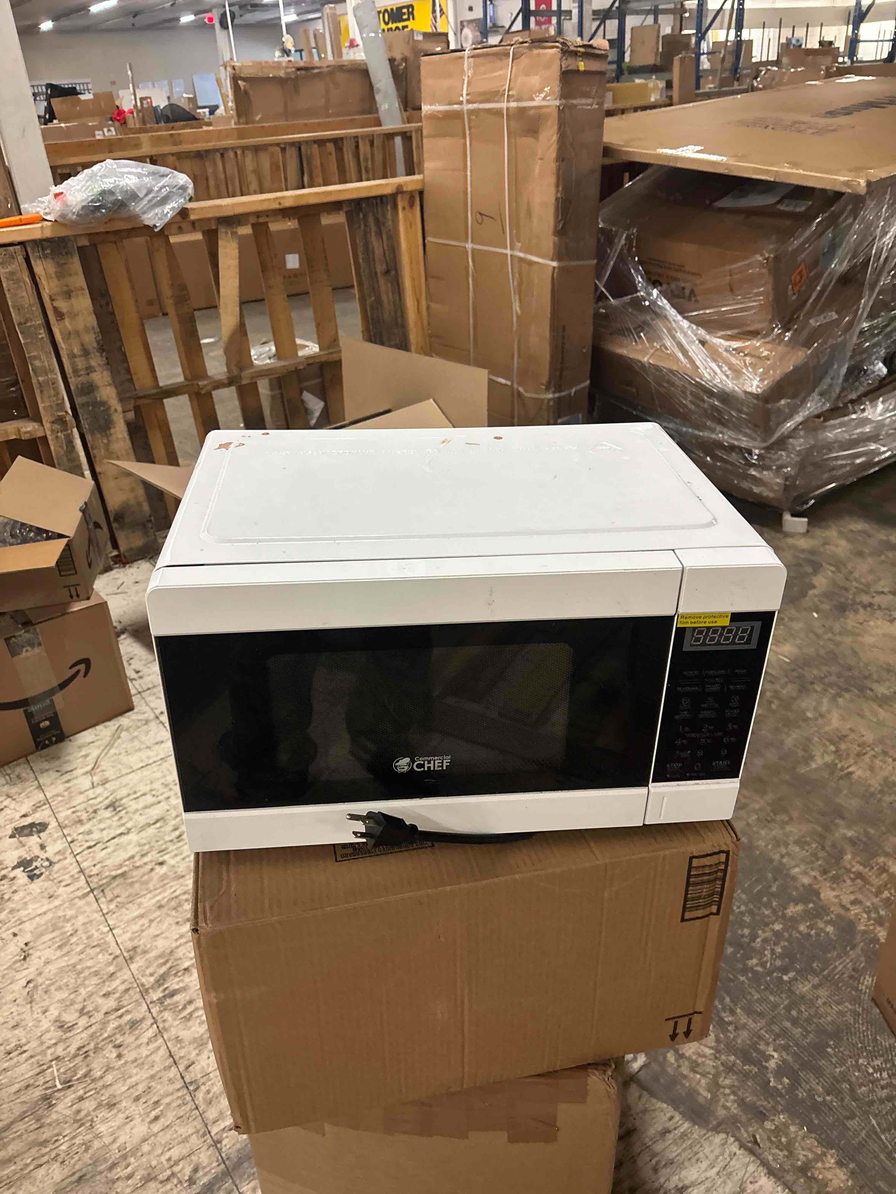 Condition photo showing As Is for Commercial Chef CHM990W 900 Watt Counter Top Microwave Oven, 0.9 Cubic Feet, White Cabinet