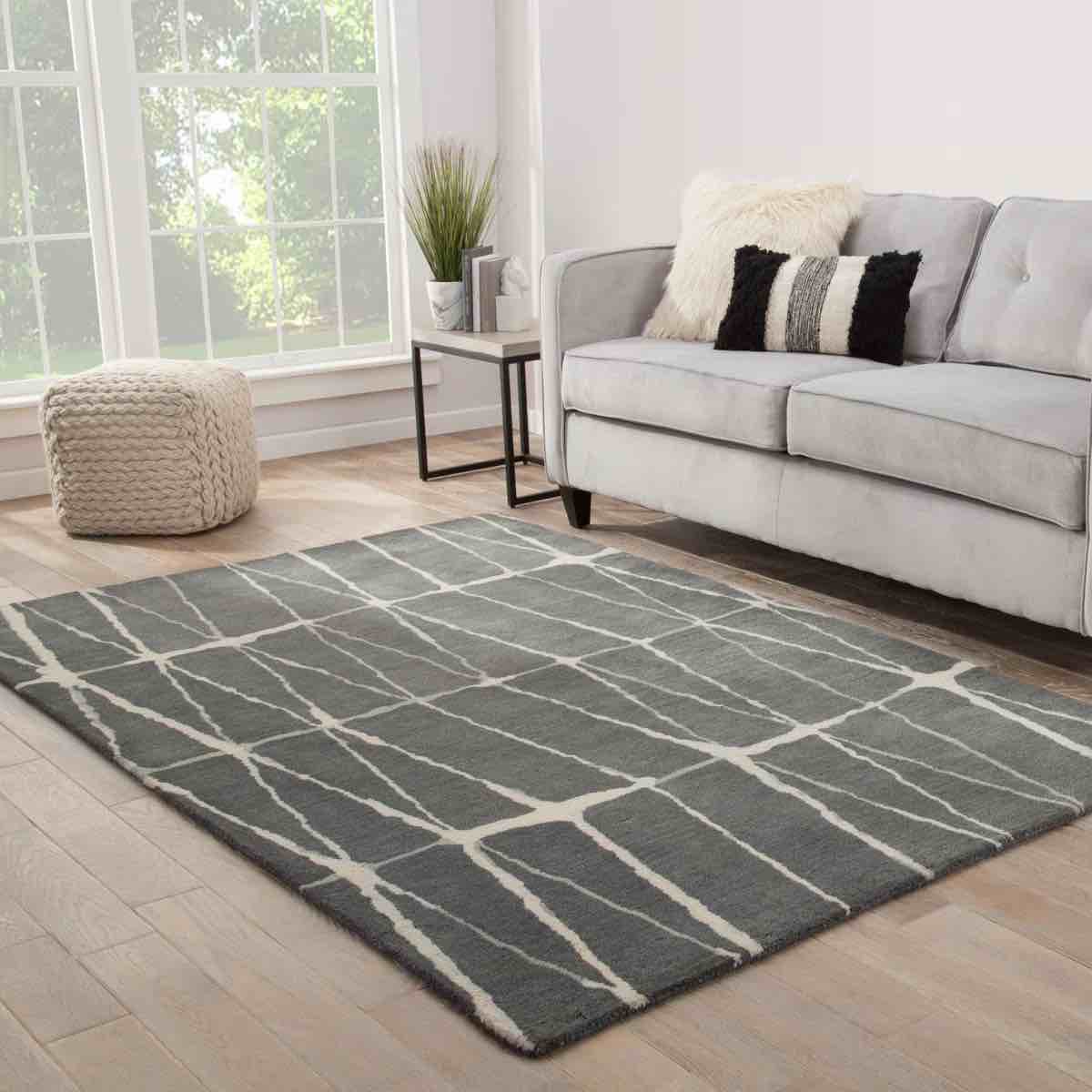 (tear in carpet all the way through) jaipur living turin hand-tufted gray/cream area rug (8x 11)