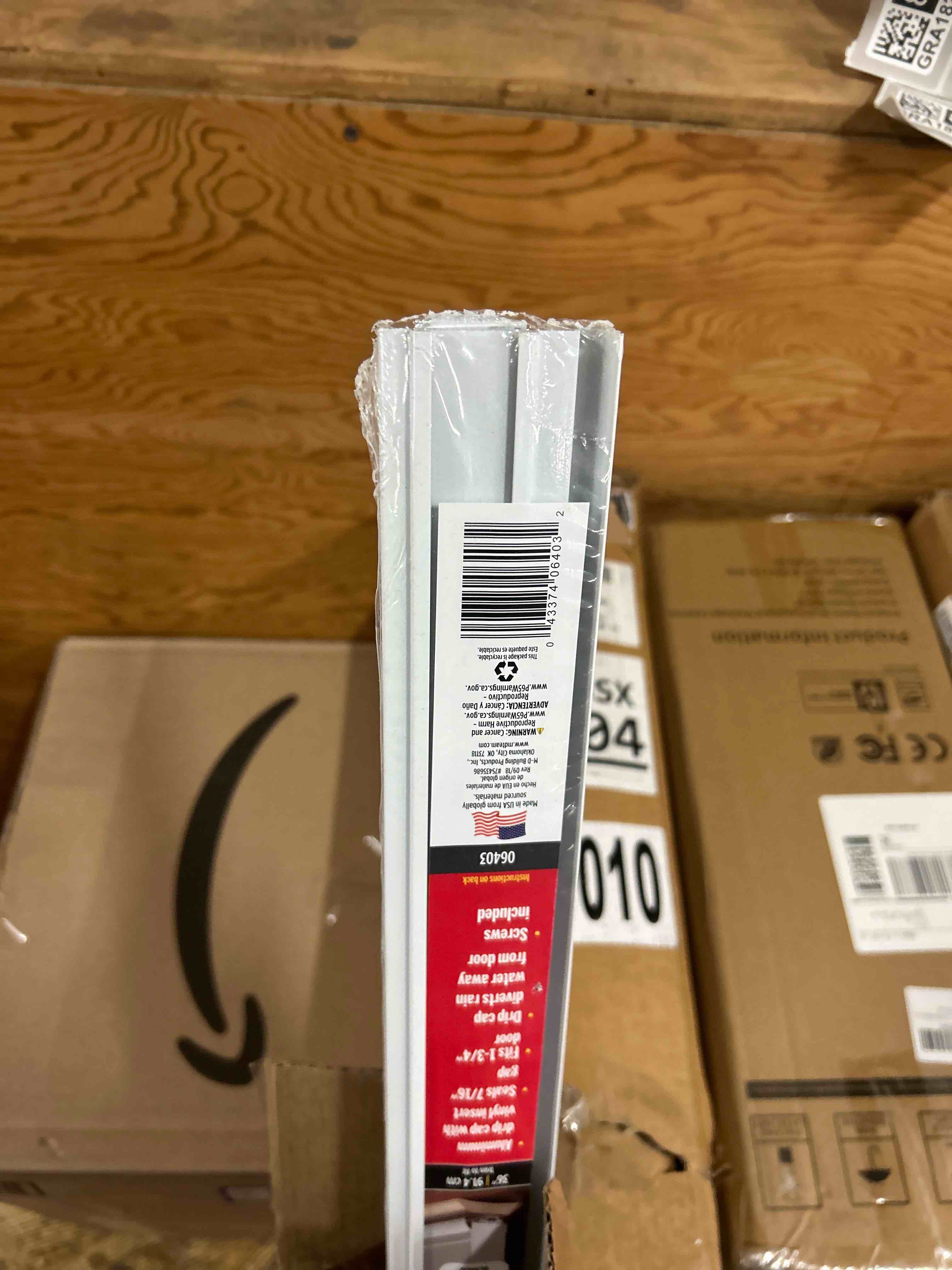 Condition photo showing New/Like New for M-D Building Products 06403 36 in. White Aluminum U-Shape Screw-on Under Door Seal