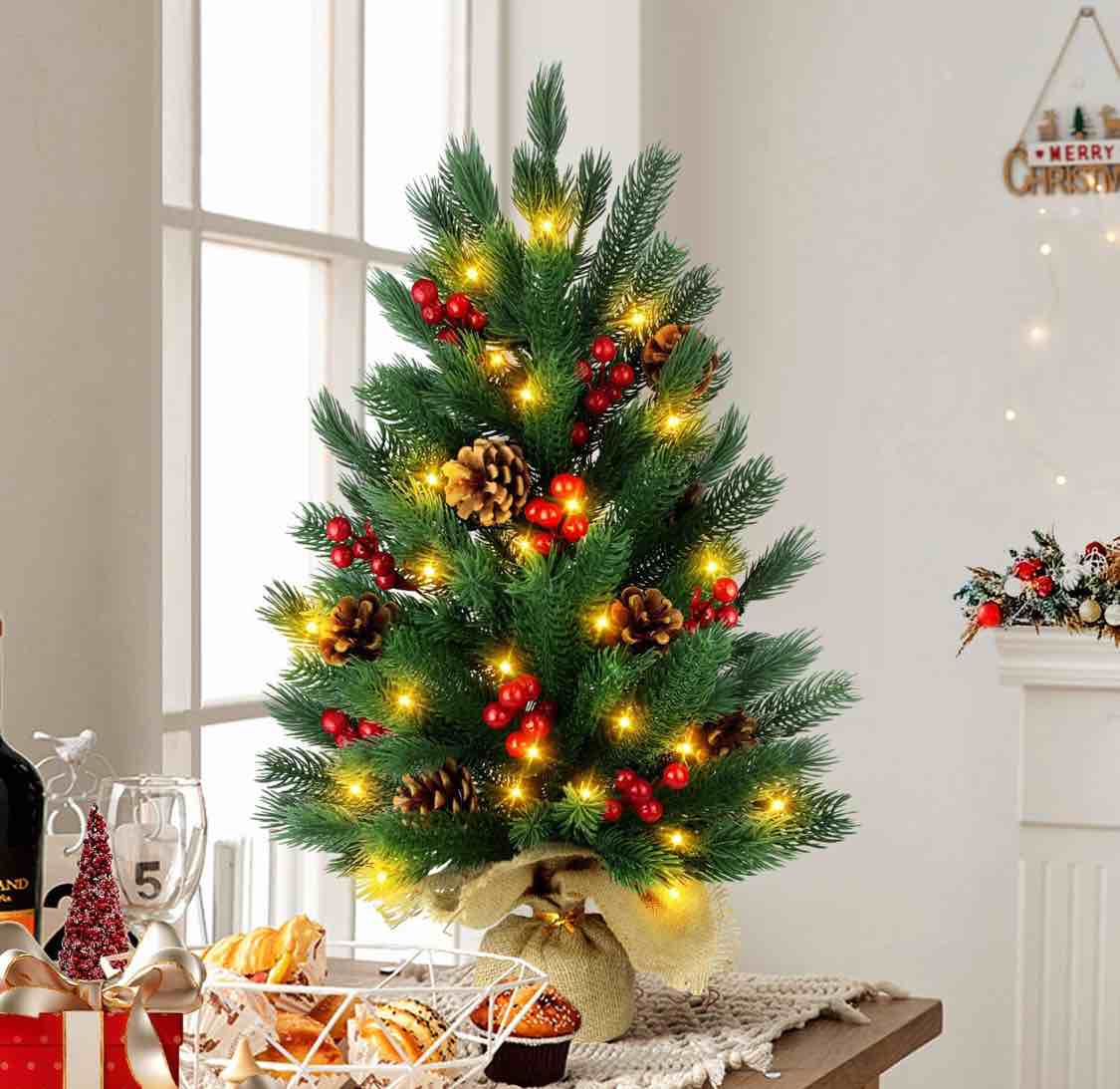 24 Inch Artificial Christmas Tree with 50 LED Lights, 2 FT Tabletop Christmas Pine Tree 55 Tips with 10 Pinecones, 70 Red Berries, Burlap Wooden Base, Christmas Winter Home Decorations