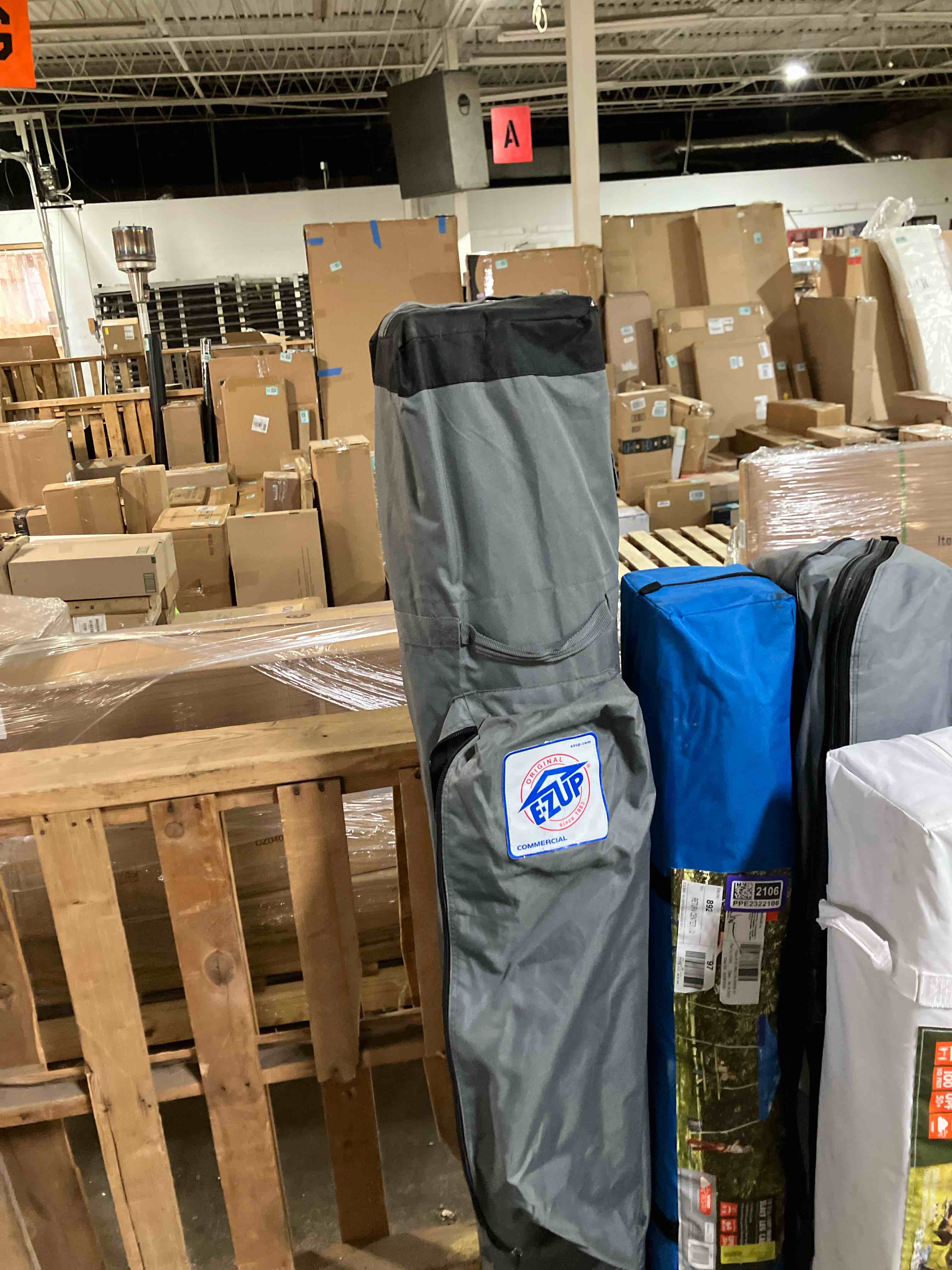 Condition photo showing As Is for E-Z Up - 12’X12’ pop up tent ( Dirty and bag has a rip)